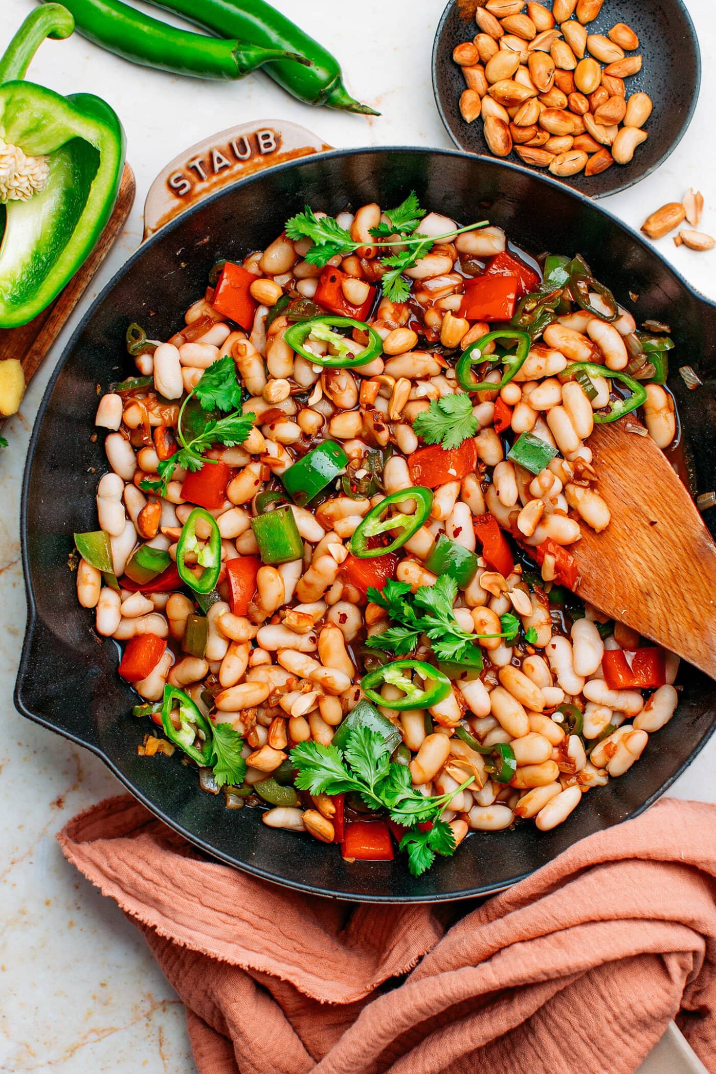 Vegan Kung Pao white beans with cilantro and peanuts.
