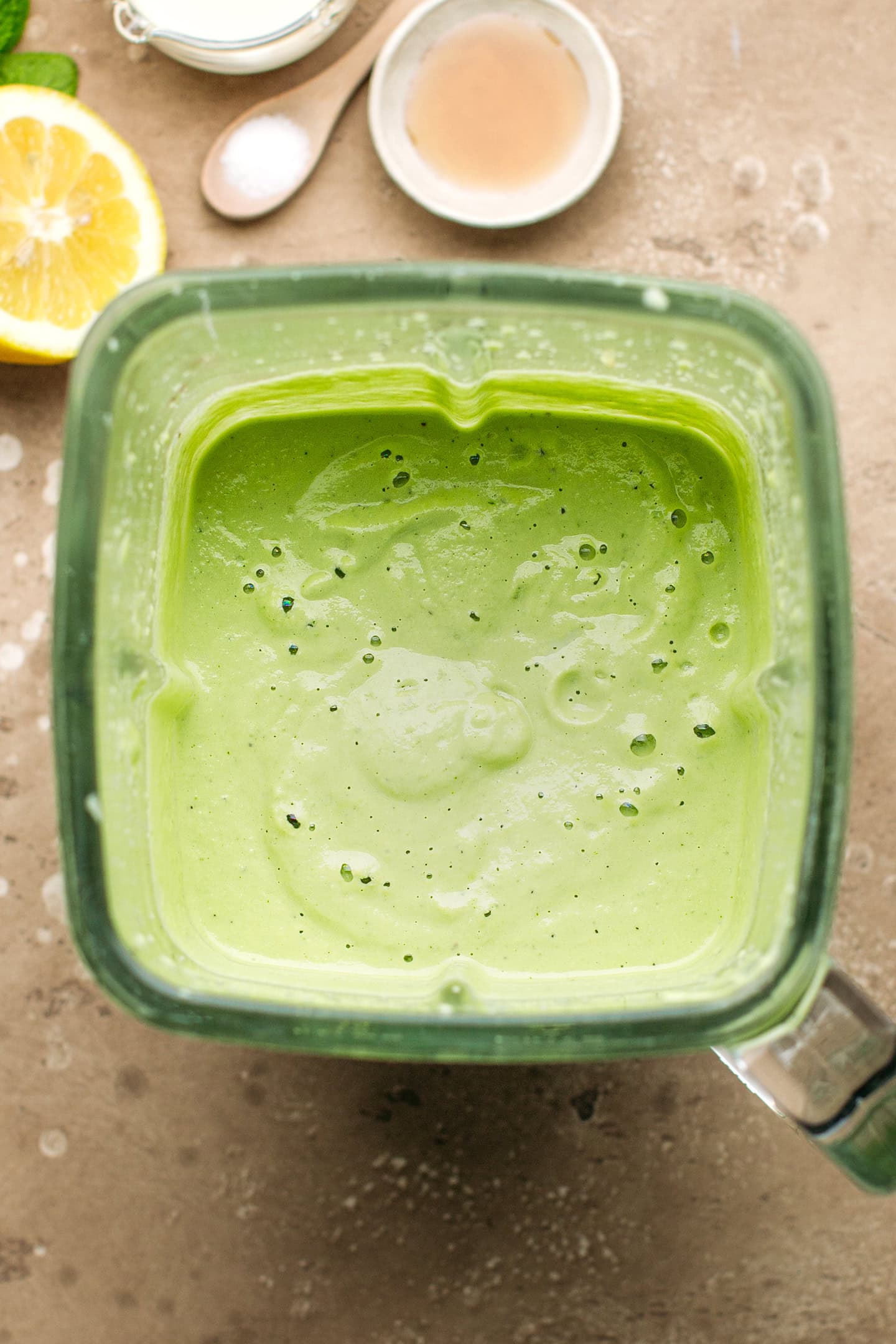 Cucumbers and cashews blended into a cream in a blender.