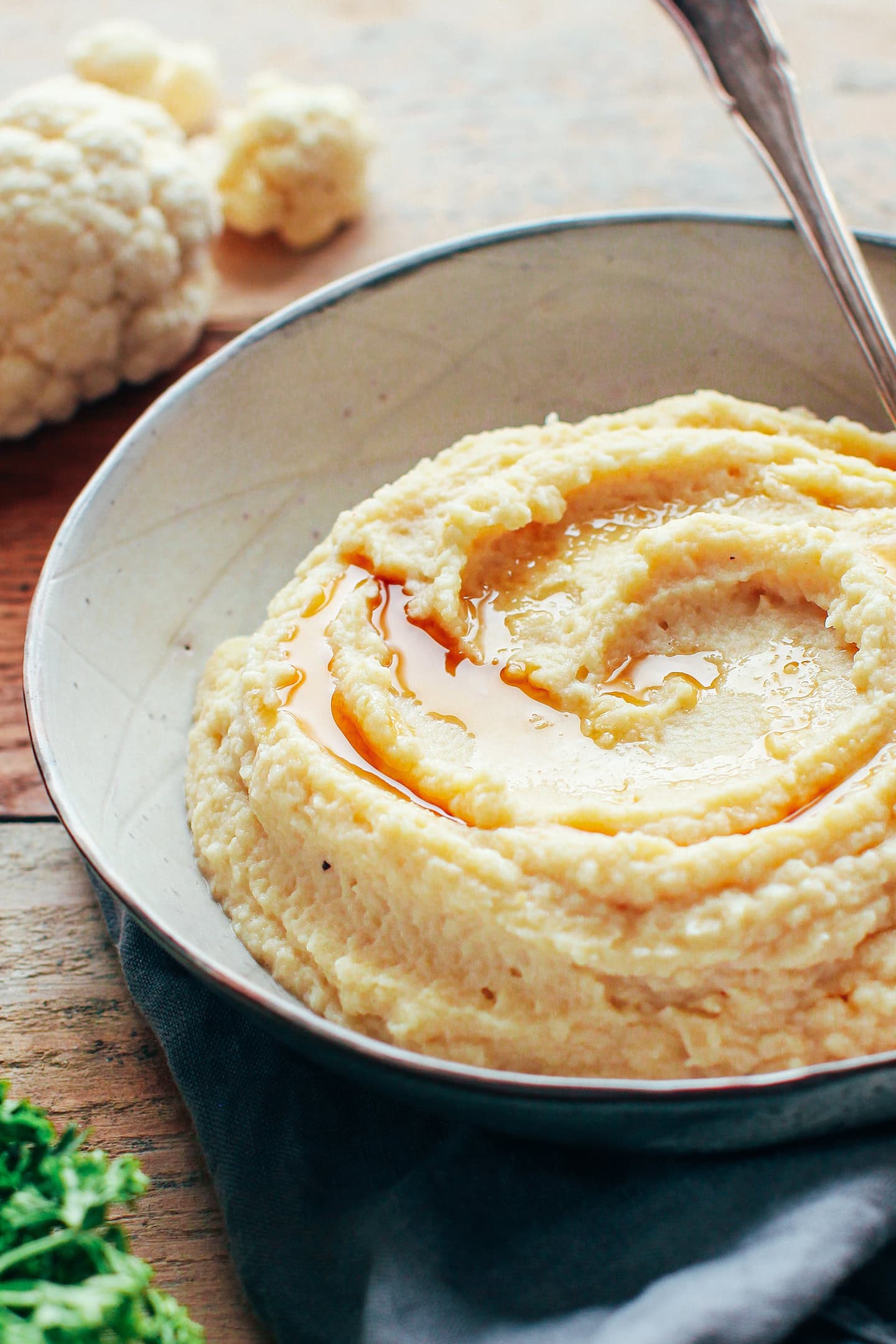 Close-up of celeria and cauliflower purée in a bowl.