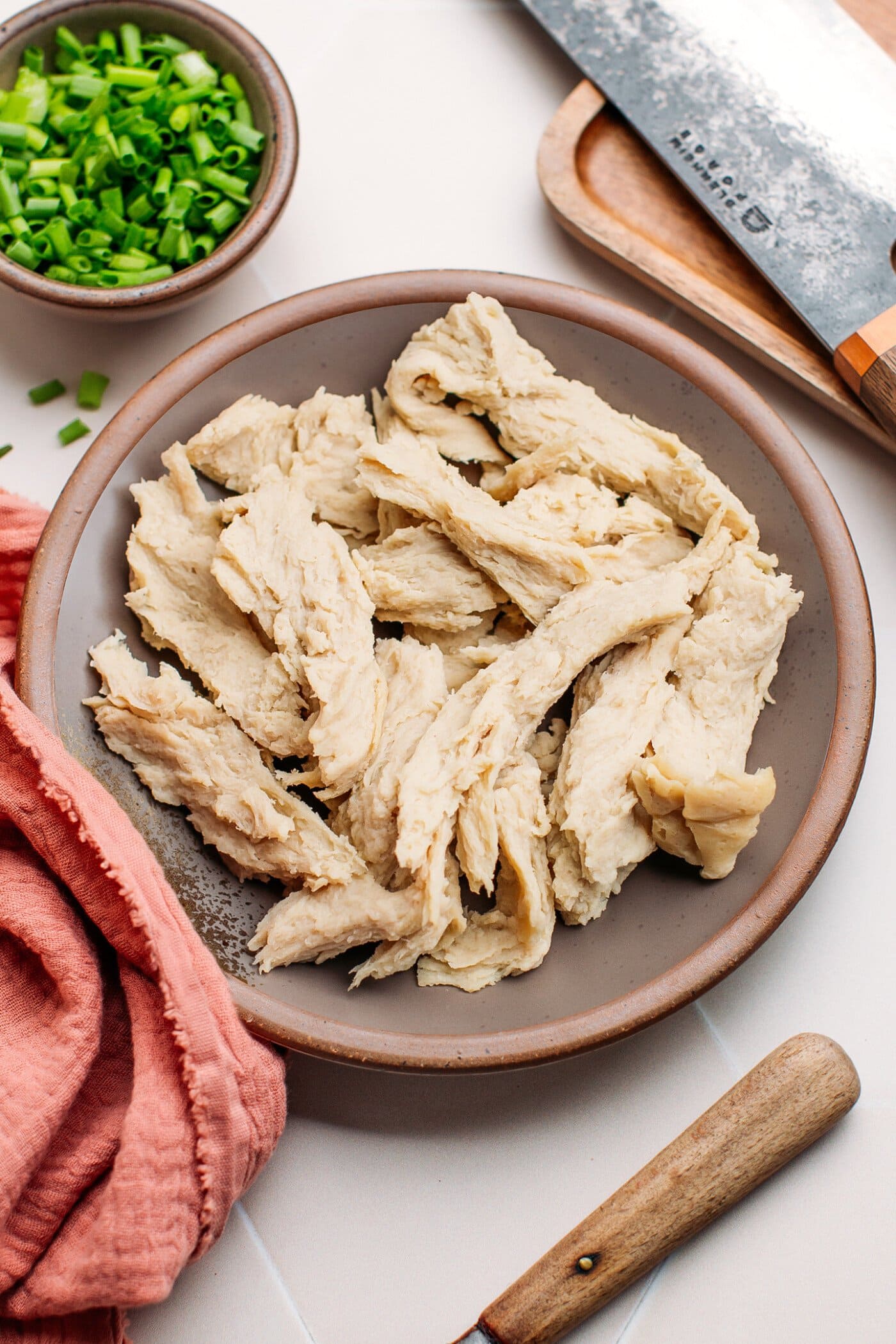 Shredded vegan chicken on a plate.