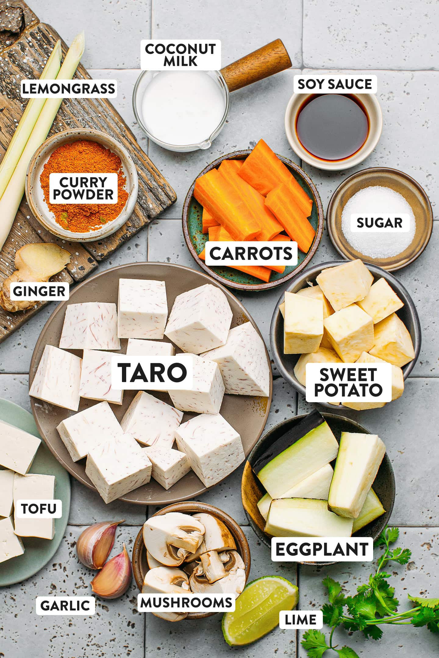 Ingredients like taro, sweet potatoes, carrots, lemongrass, and mushrooms.