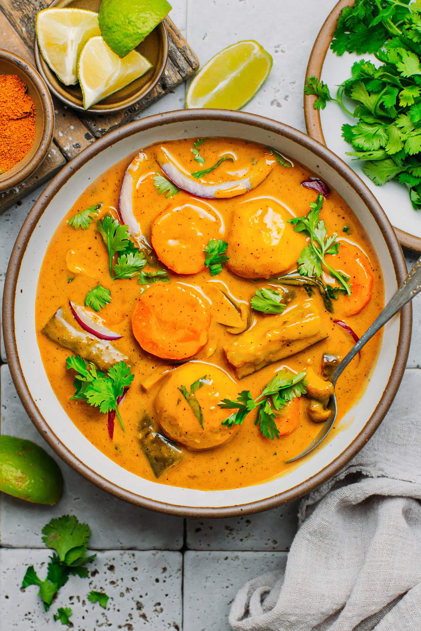 Vegan Vietnamese curry with taro, potatoes, eggplants, and cilantro in a bowl.