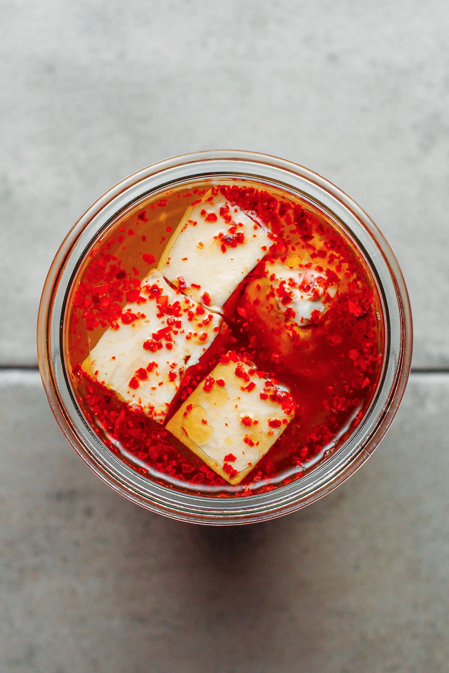 Fermented tofu with chili in a brine.