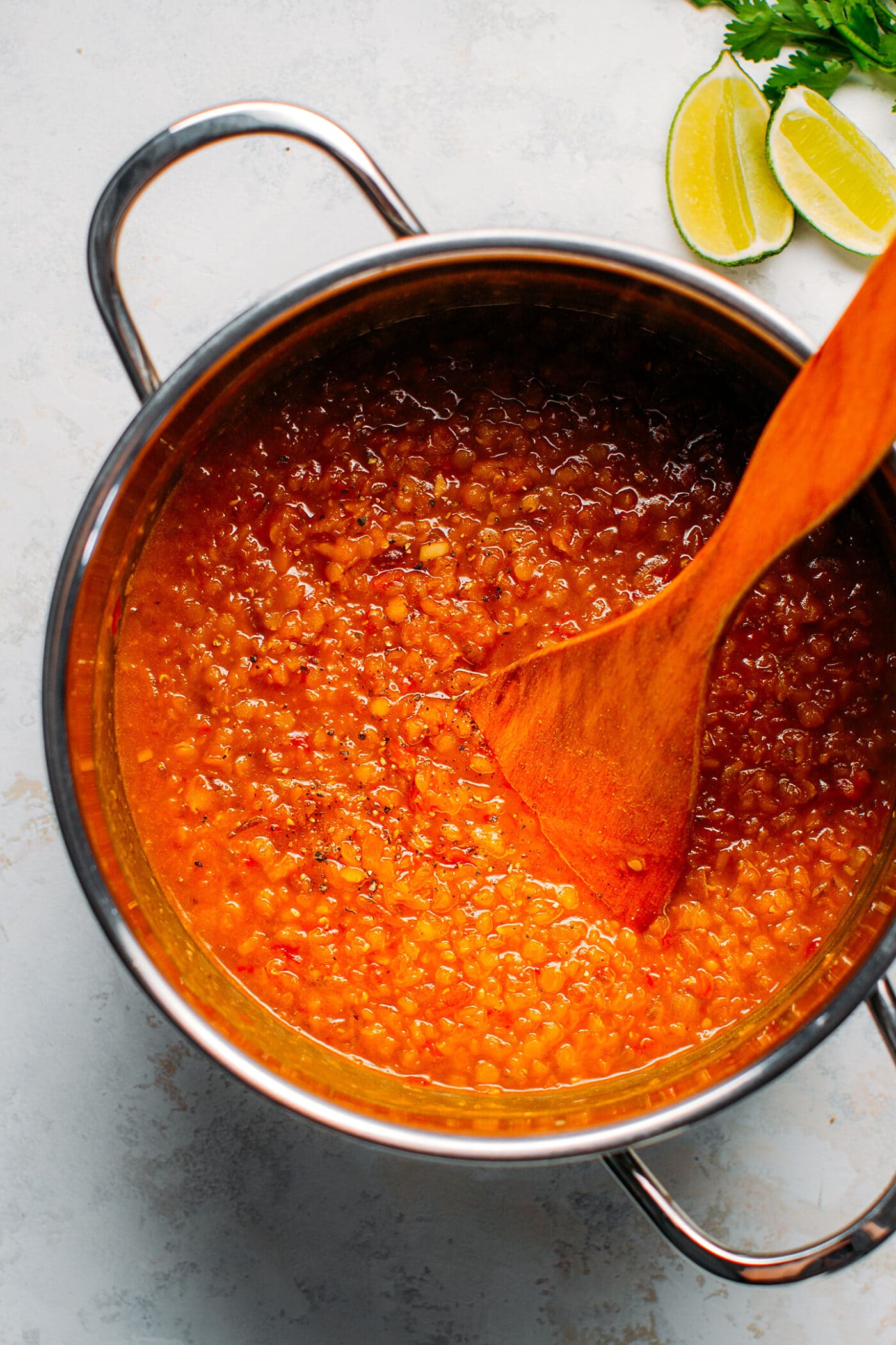 Sweet and sour red lentil soup in a pot.