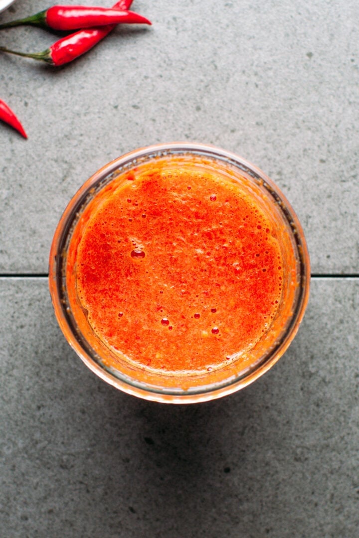 Blended chilies in a blender bowl.