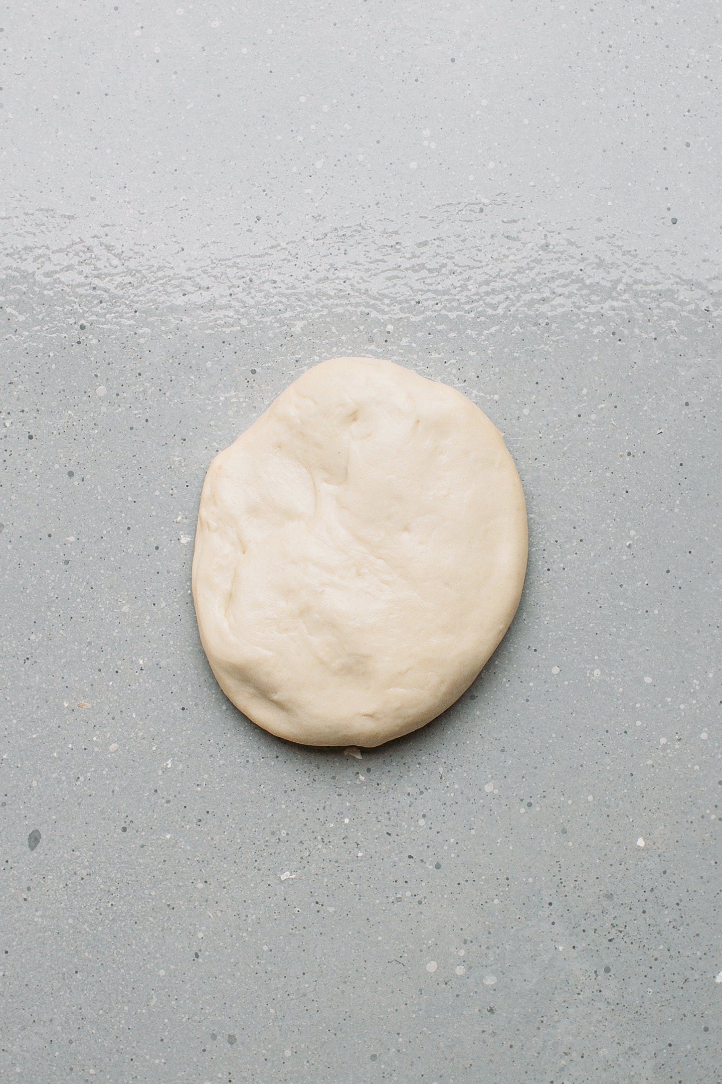 Flattened ball of dough.
