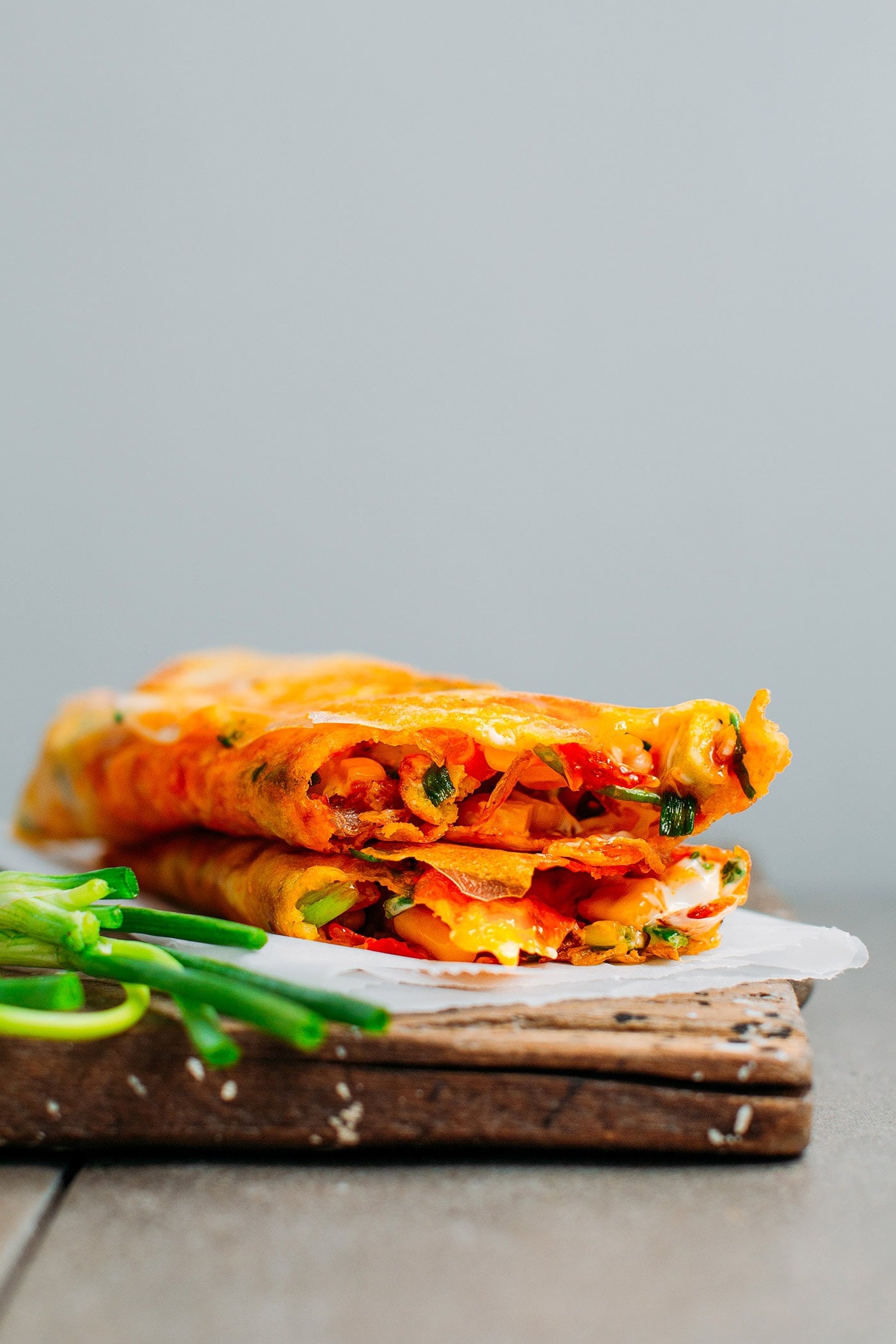 Two Bánh Tráng Nướng stacked on top of each other.