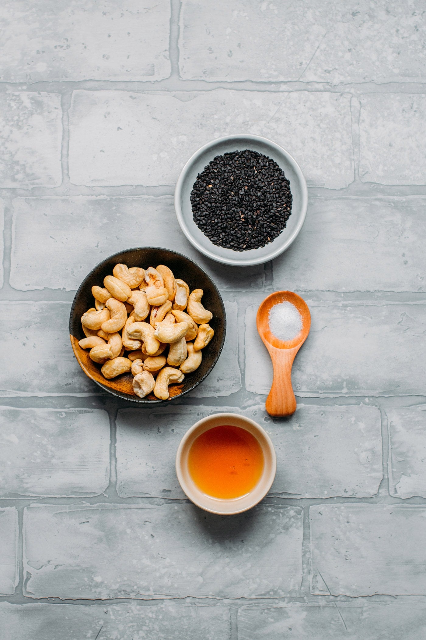 Ingredients like black sesame seeds, raw cashews, and salt.