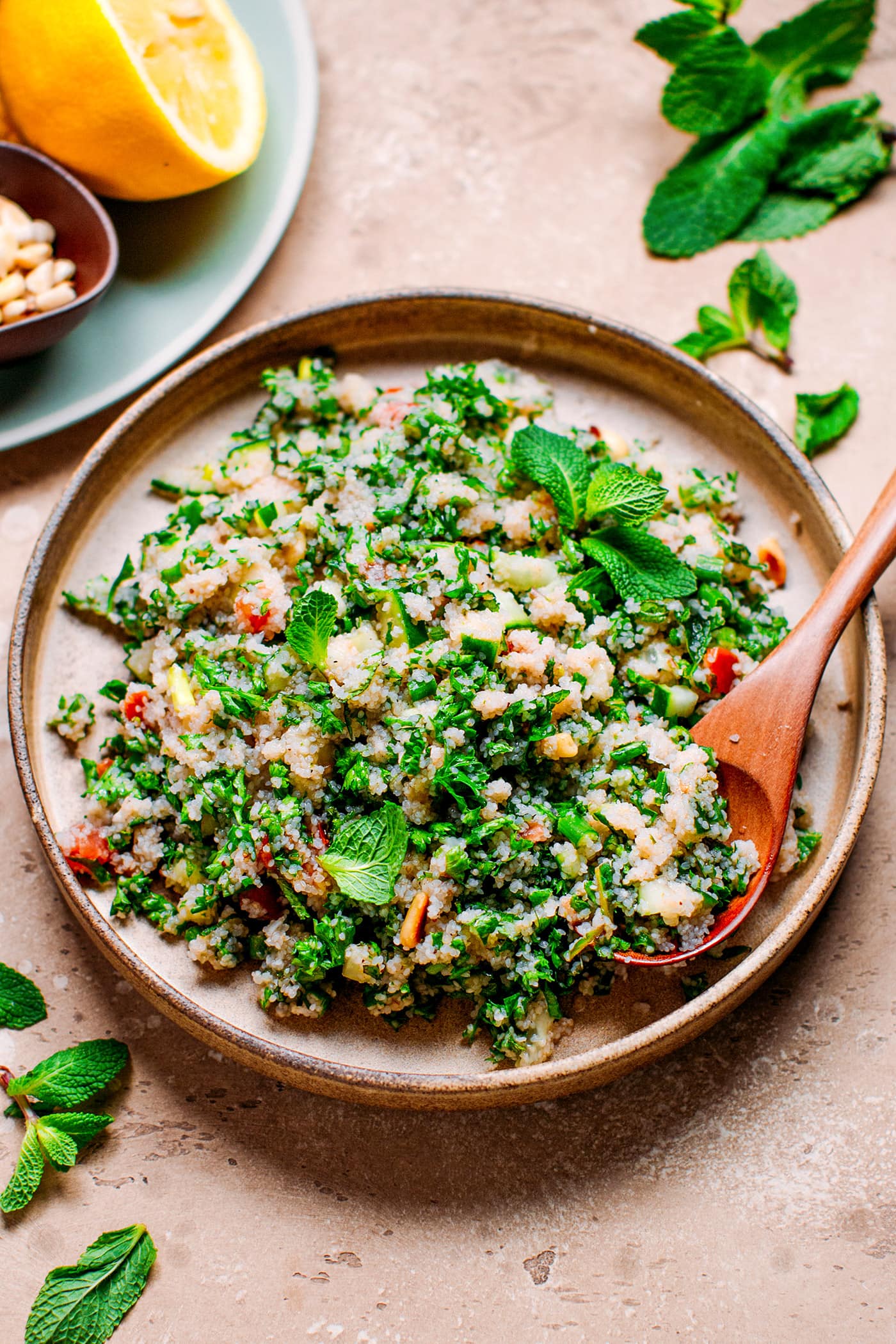 Fonio tabbouleh with fresh herbs on a plate.