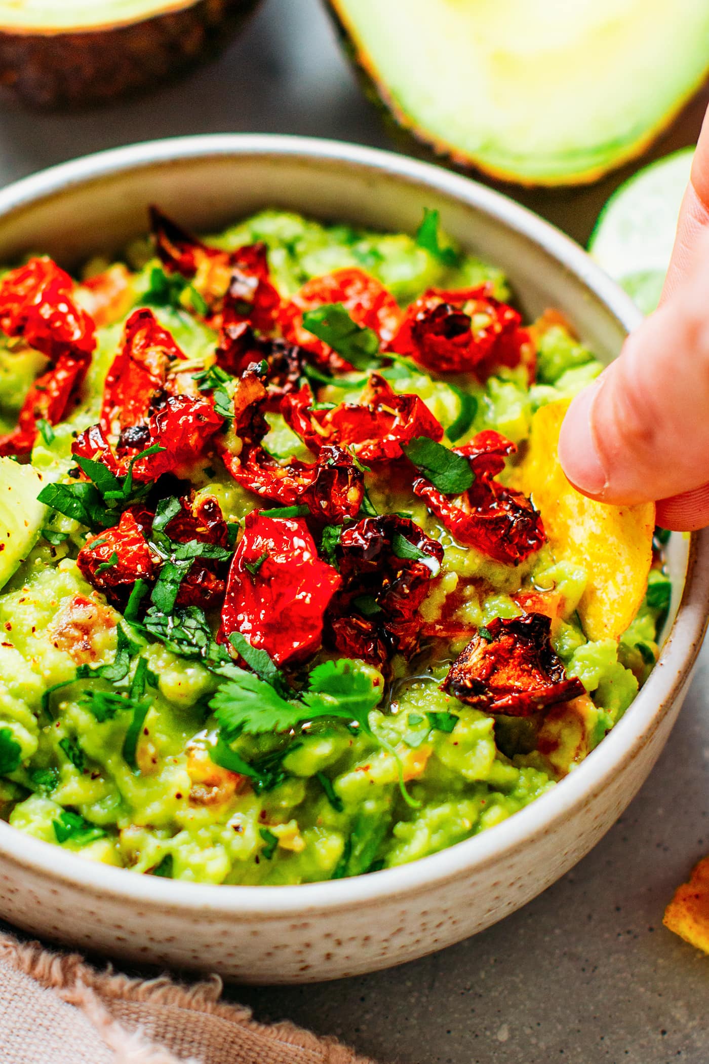 Close up of guacamole with dried tomatoes.