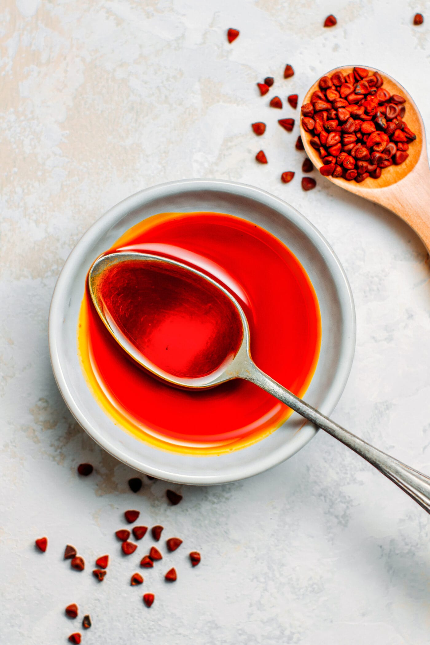 Annatto oil in a small bowl.
