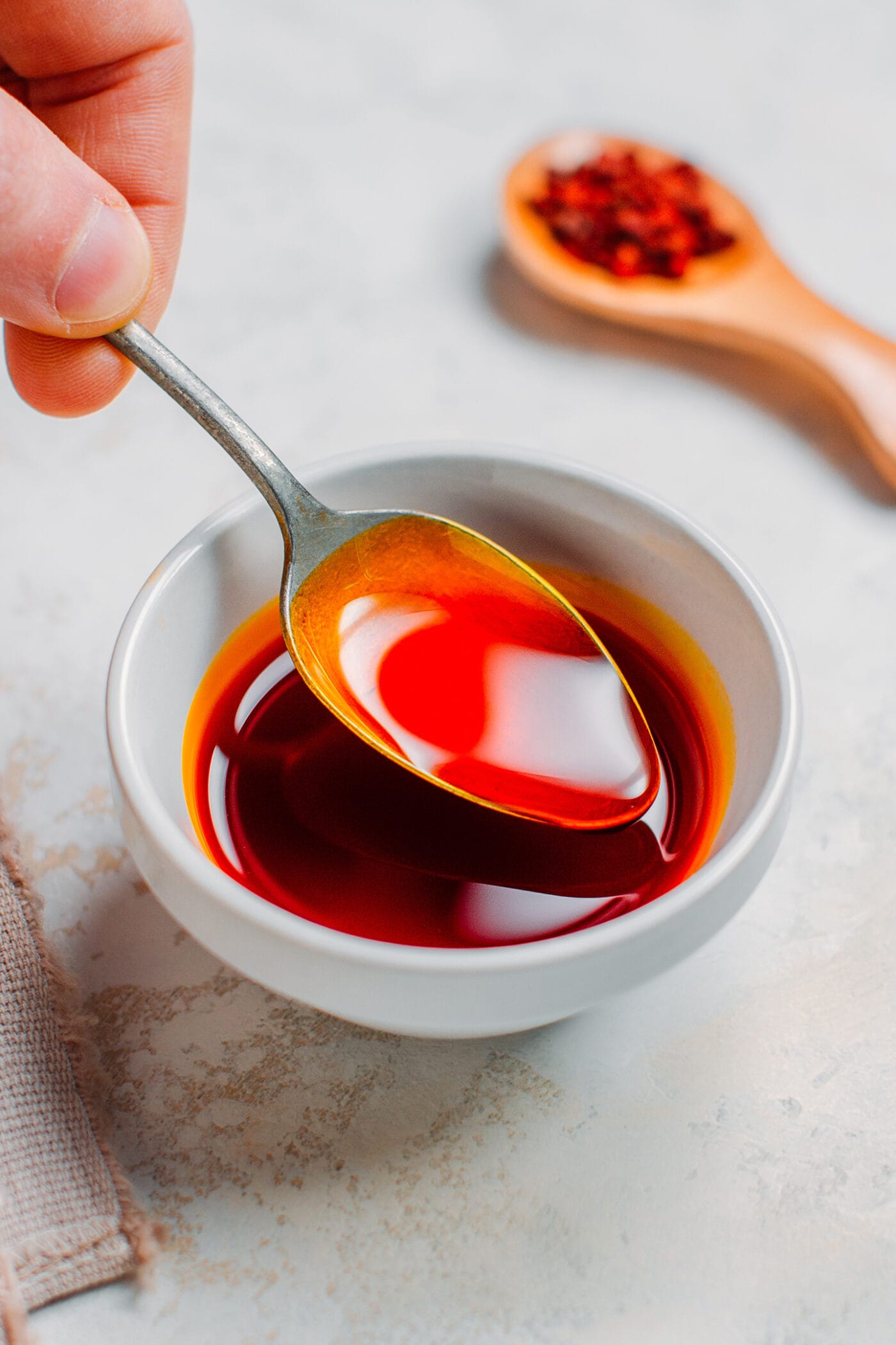 Annatto oil in a small bowl.