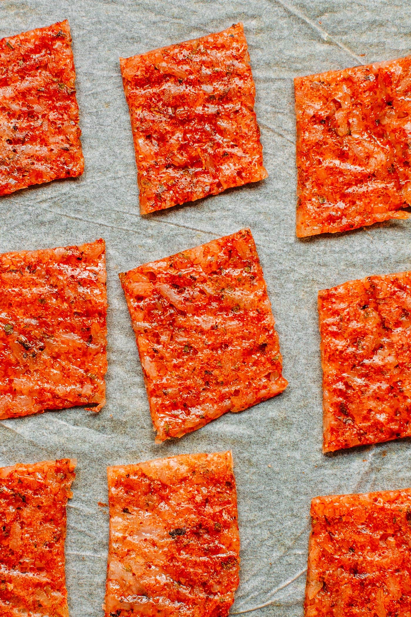 Dried rice crackers on a baking sheet.
