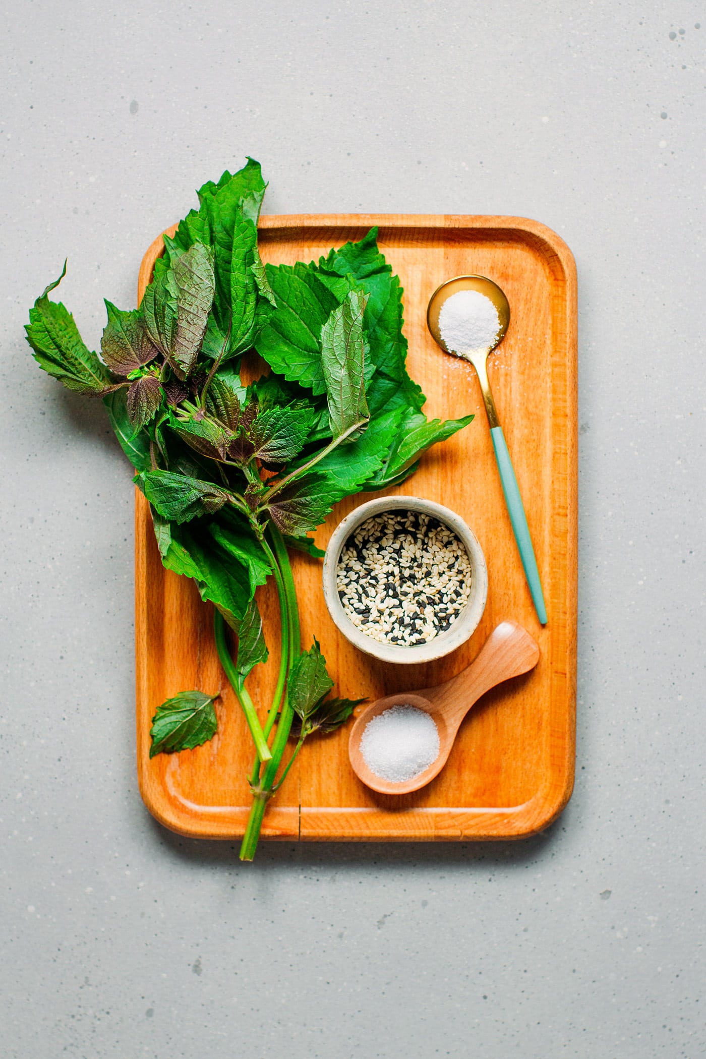 Ingredients like green shiso leaves, sesame seeds, sugar, and salt.