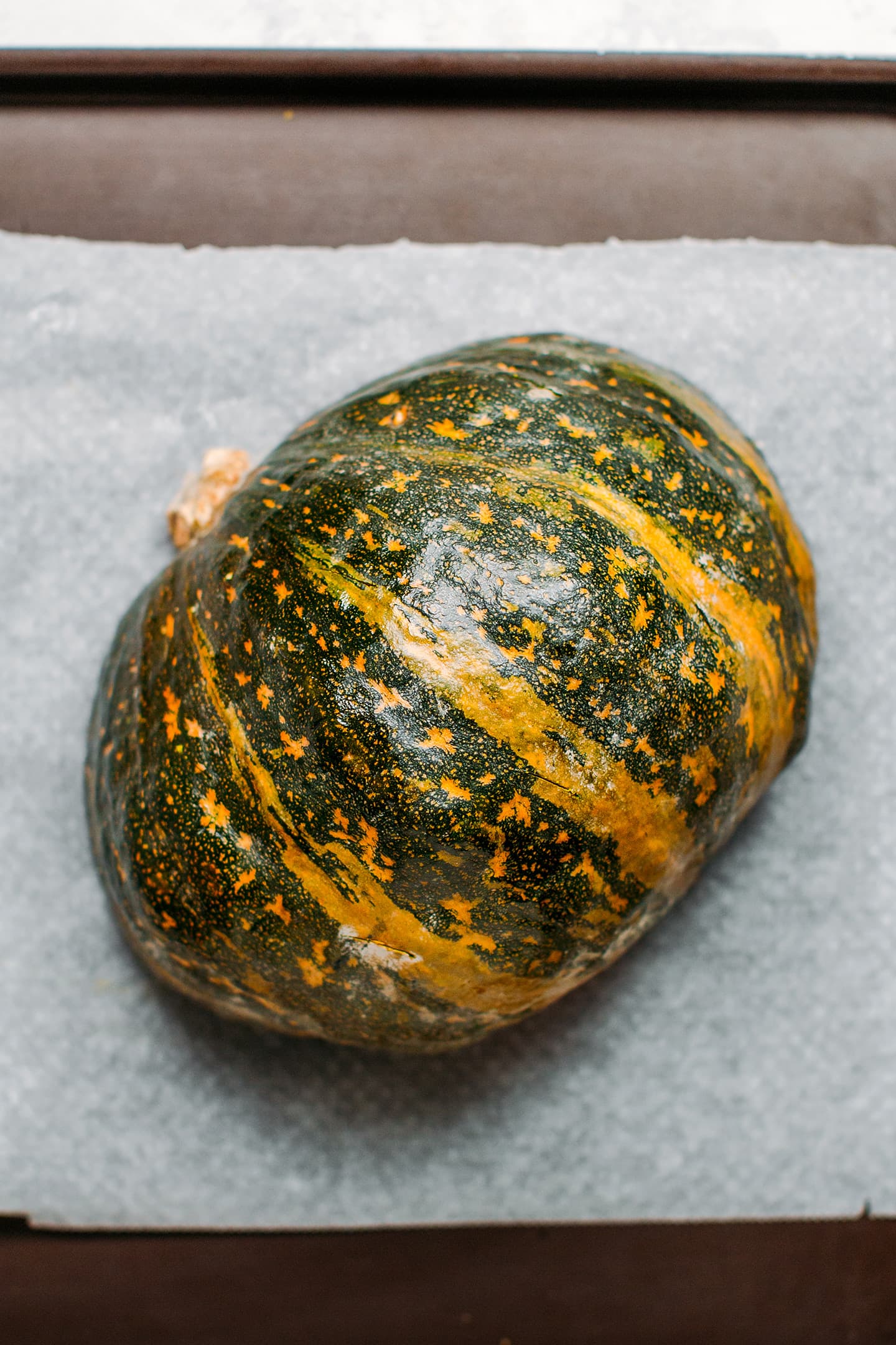 Kabocha squash on a baking sheet.