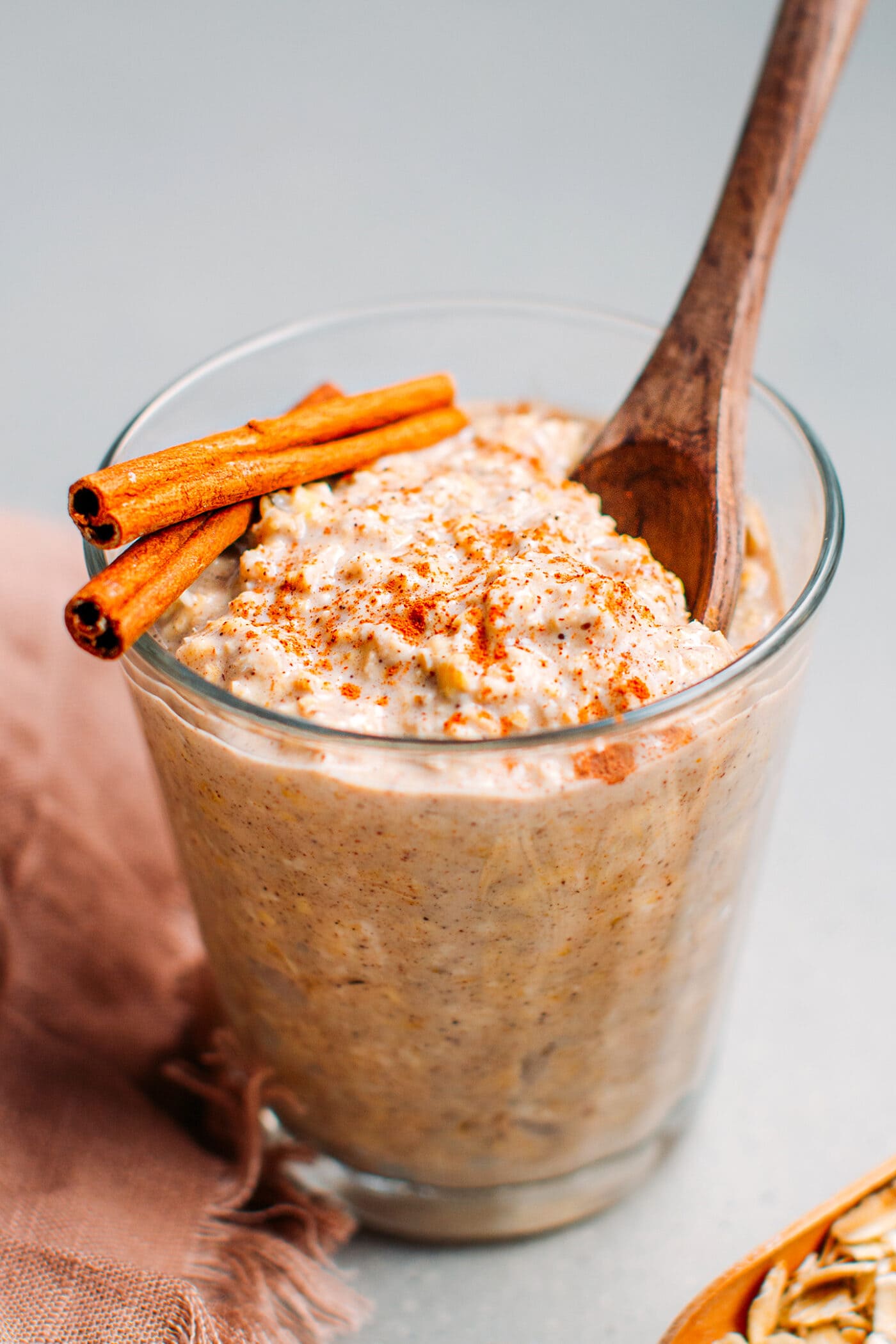 Chai latte overnight oats topped with cinnamon powder.