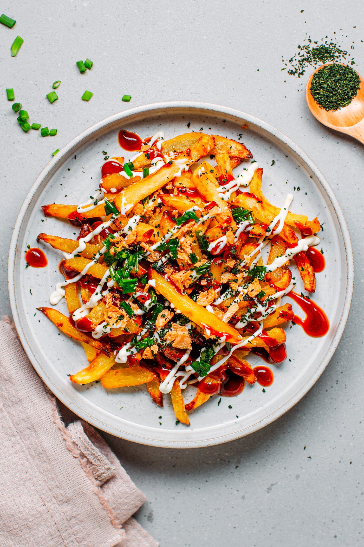 French fries topped with okonomiyaki sauce, green onions, aonori flakes and crispy onions.