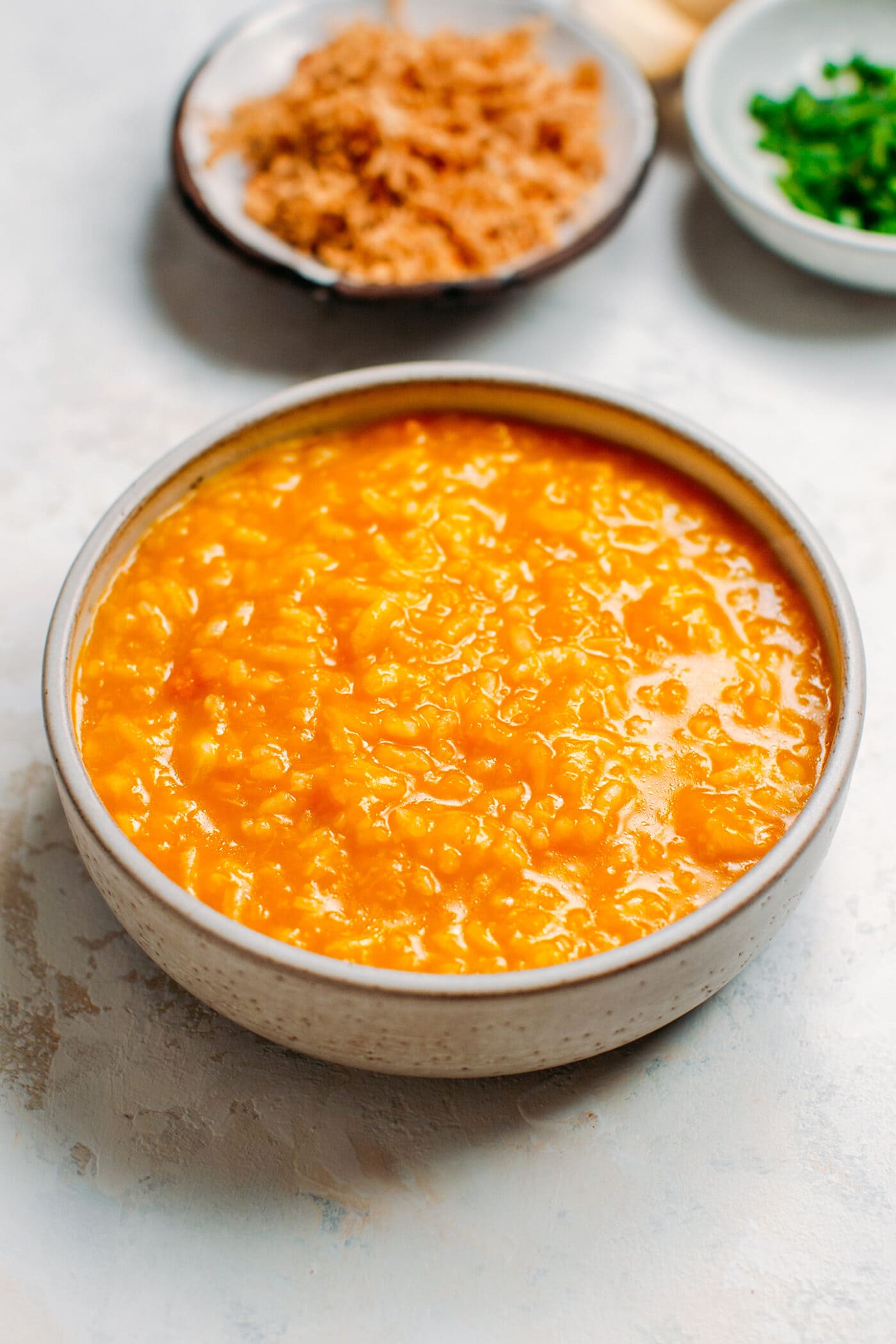Pumpkin congee in a bowl.
