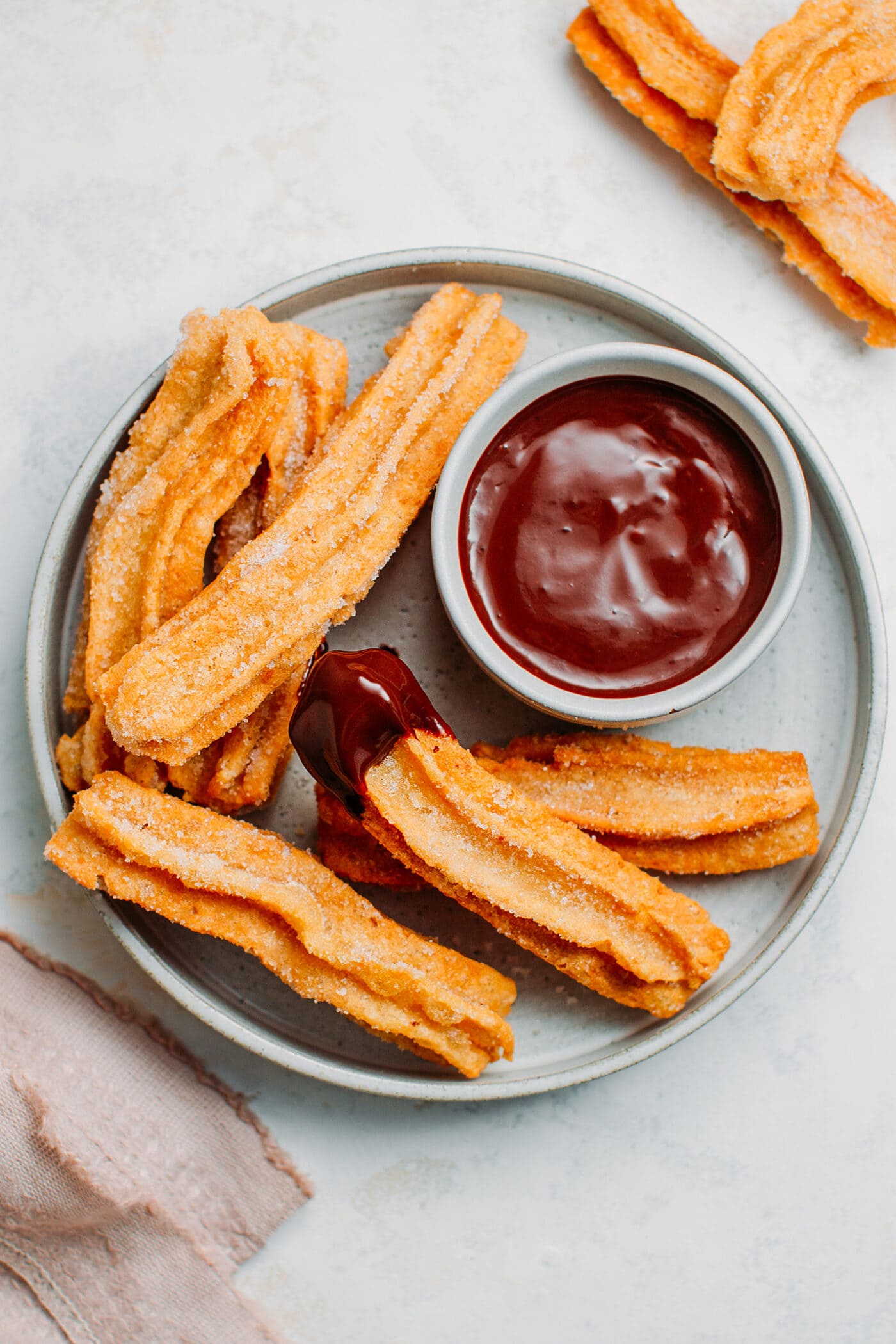 Vegan gluten-free churros with chocolate dipping sauce.
