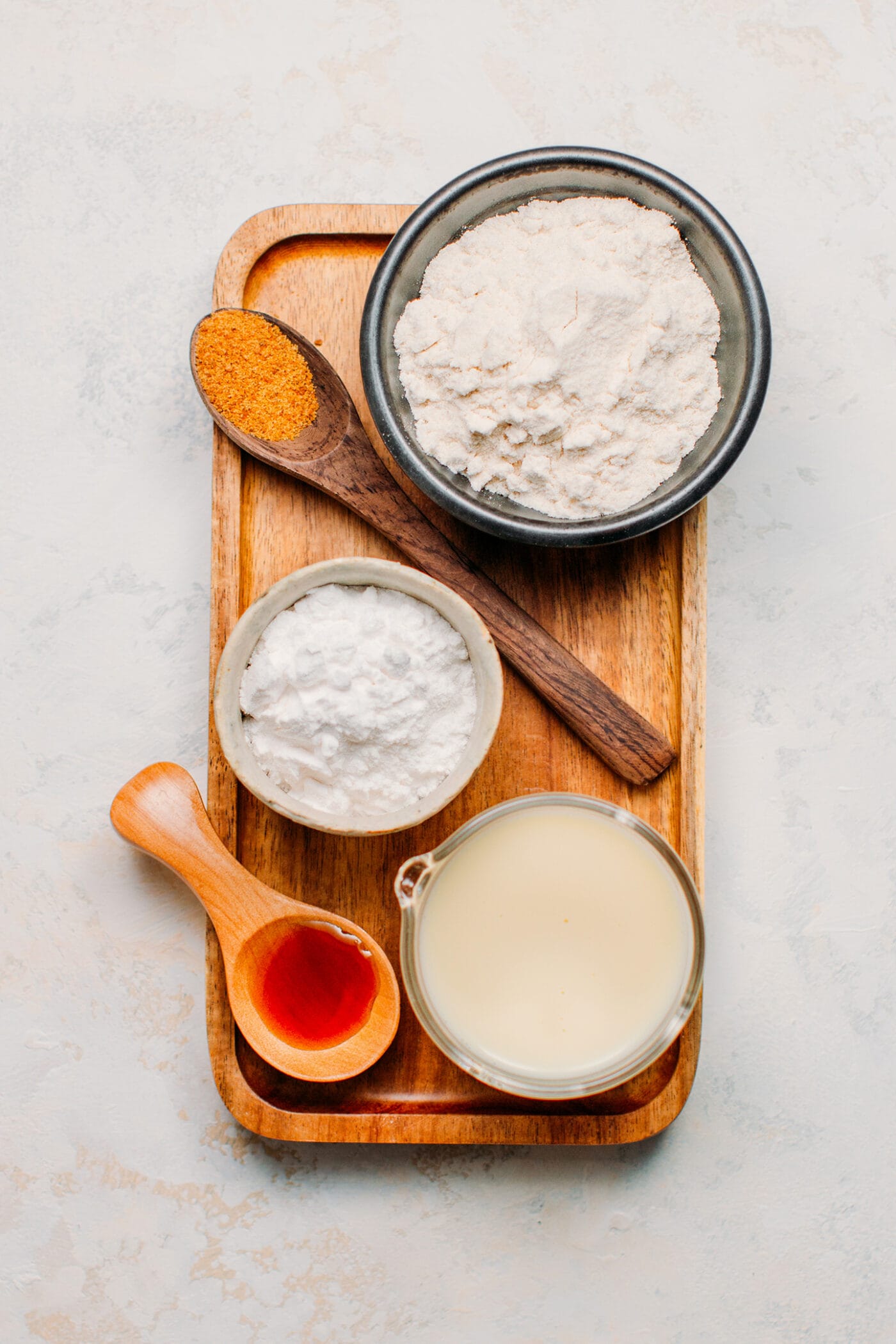 Ingredients like rice flour, cornstarch, almond milk, coconut sugar, vanilla extract.