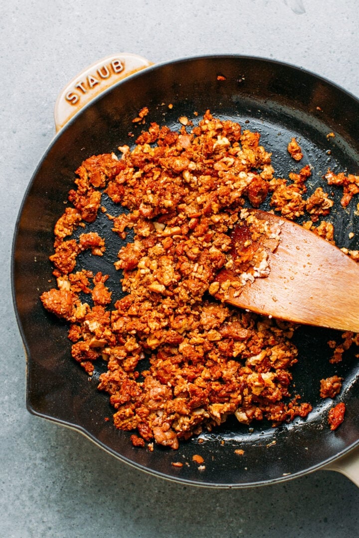Tofu and vegan ground meat in a skillet.