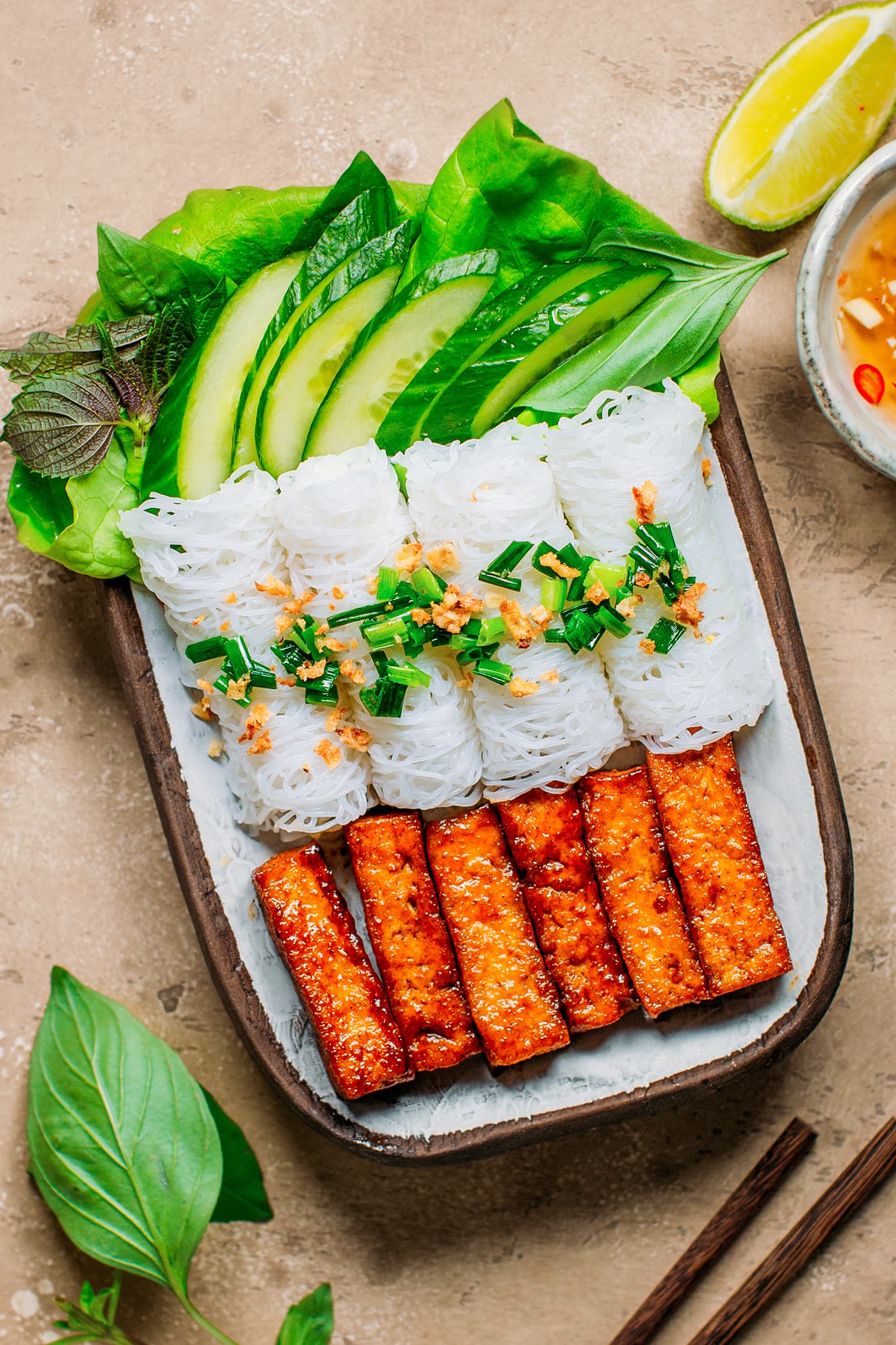 Vietnamese rice vermicelli woven with chewy tofu and fresh herbs.
