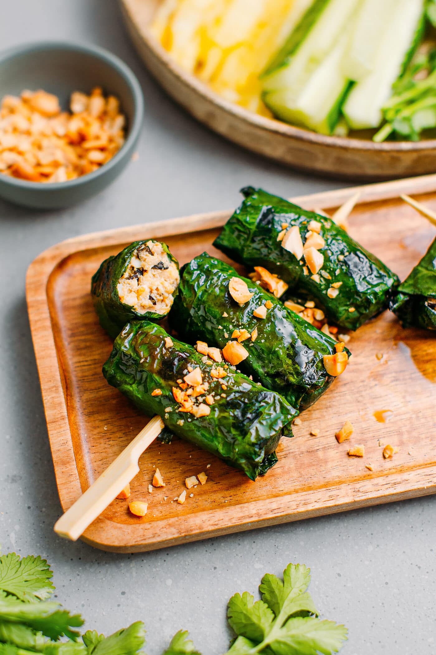 Grilled betel leaves topped with crushed peanuts.