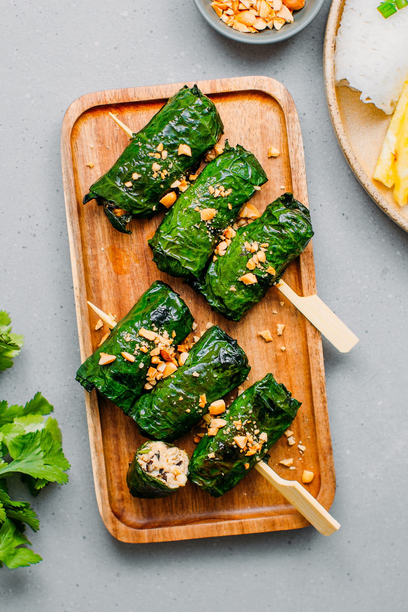 Grilled betel leaves topped with chopped peanuts.