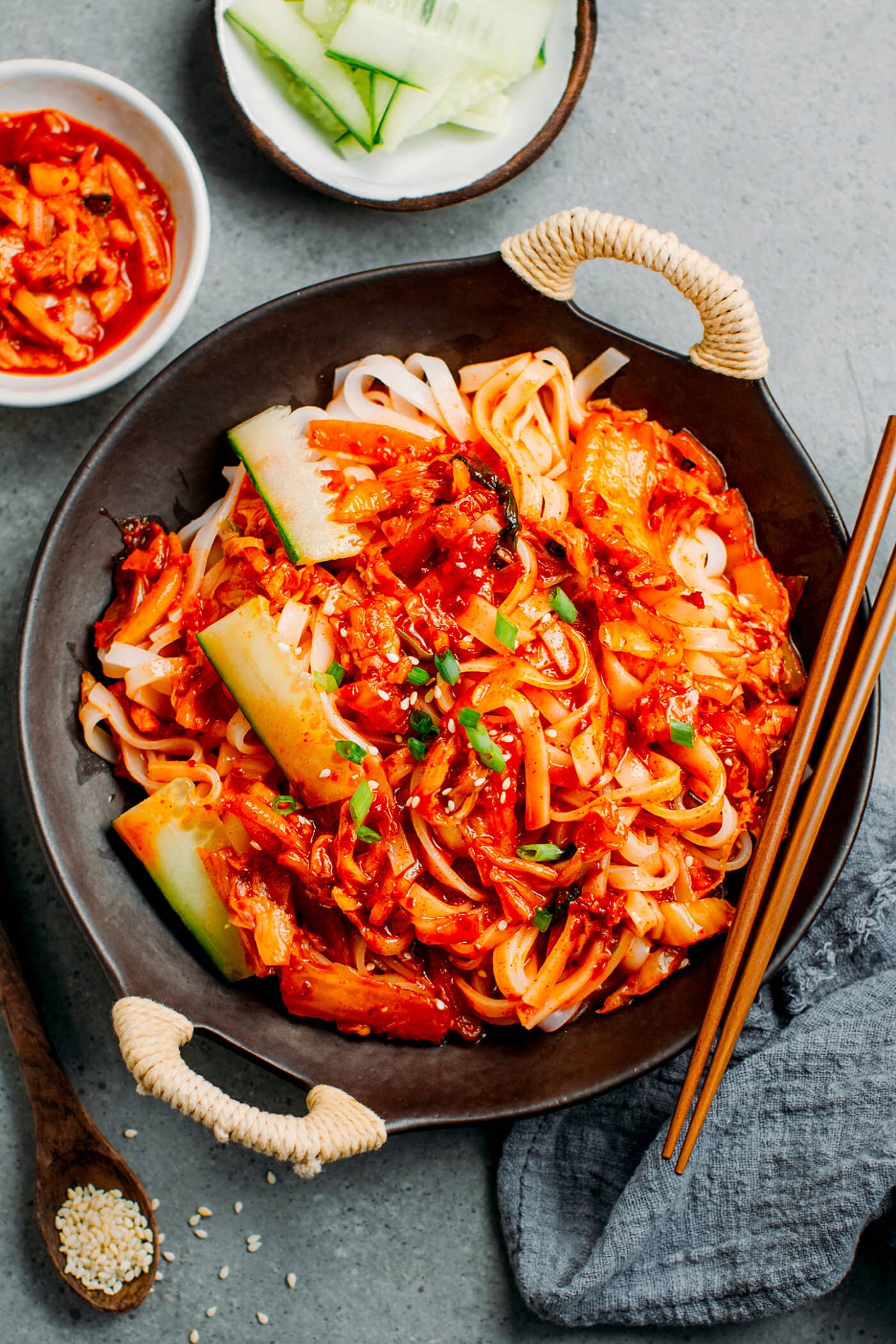 Kimchi Bibim Guksu with cucumber and scallions.