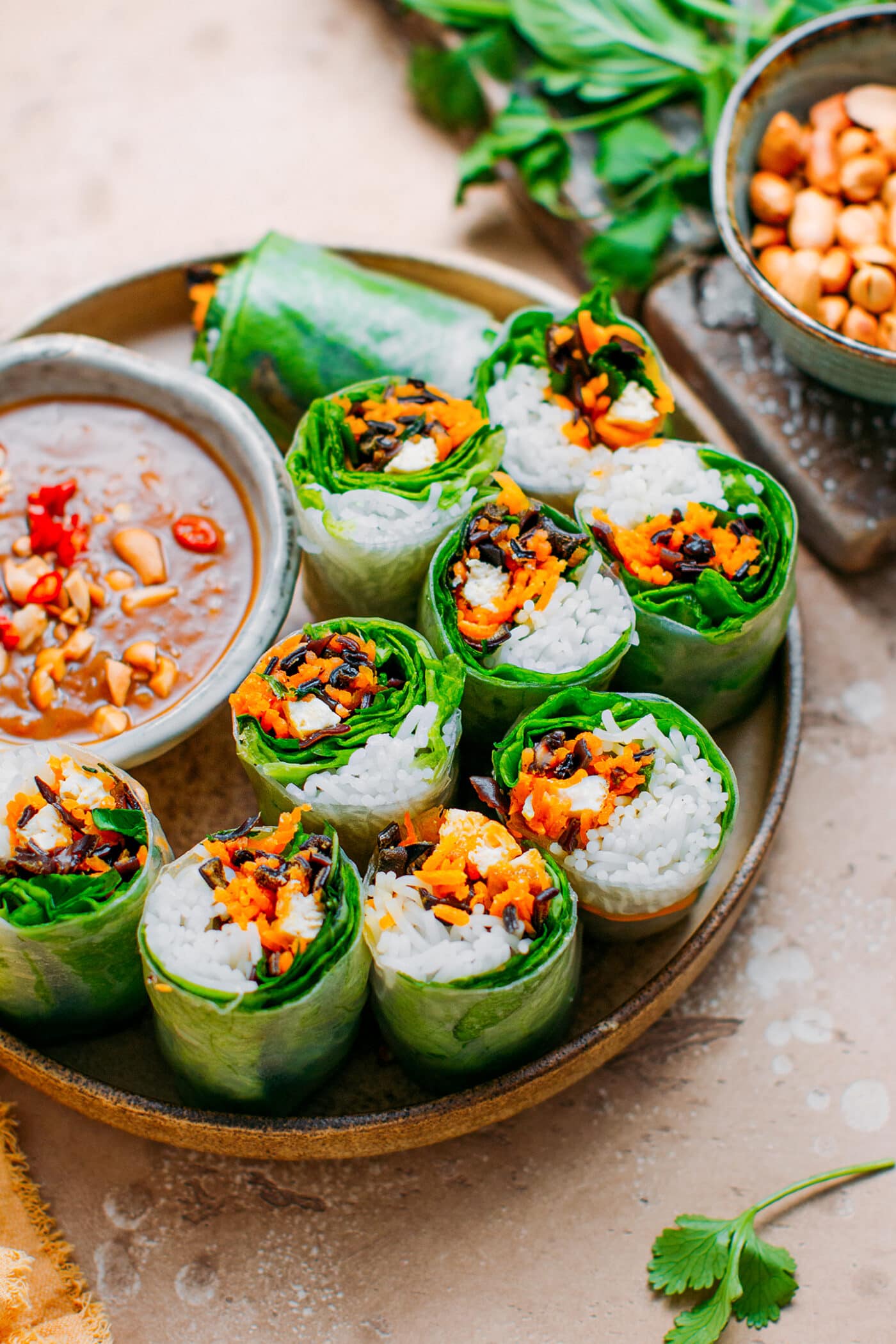 Vegetarian spring rolls with carrots, tofu, mushrooms, and fresh herbs.