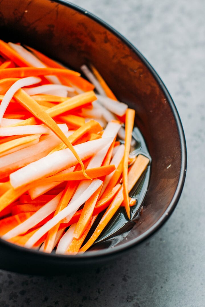 Carrots and daikon radish in a bowl.