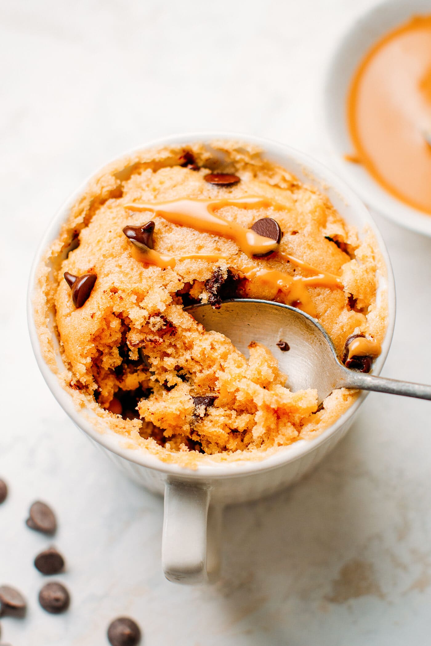 Vegan peanut butter mug cake with dark chocolate chips.