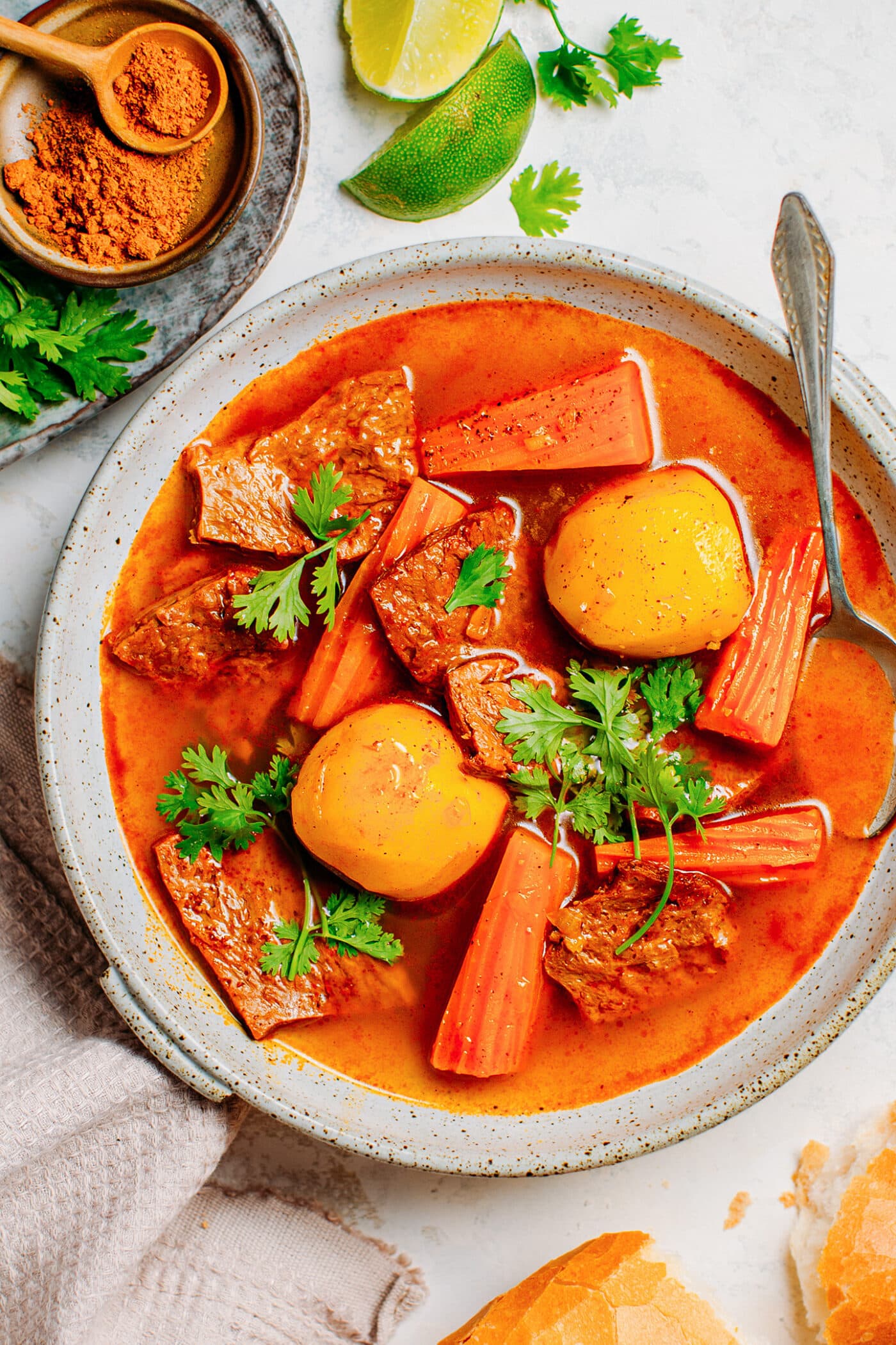 Close up of vegan beef stew with carrots, potatoes, and vegan beef.