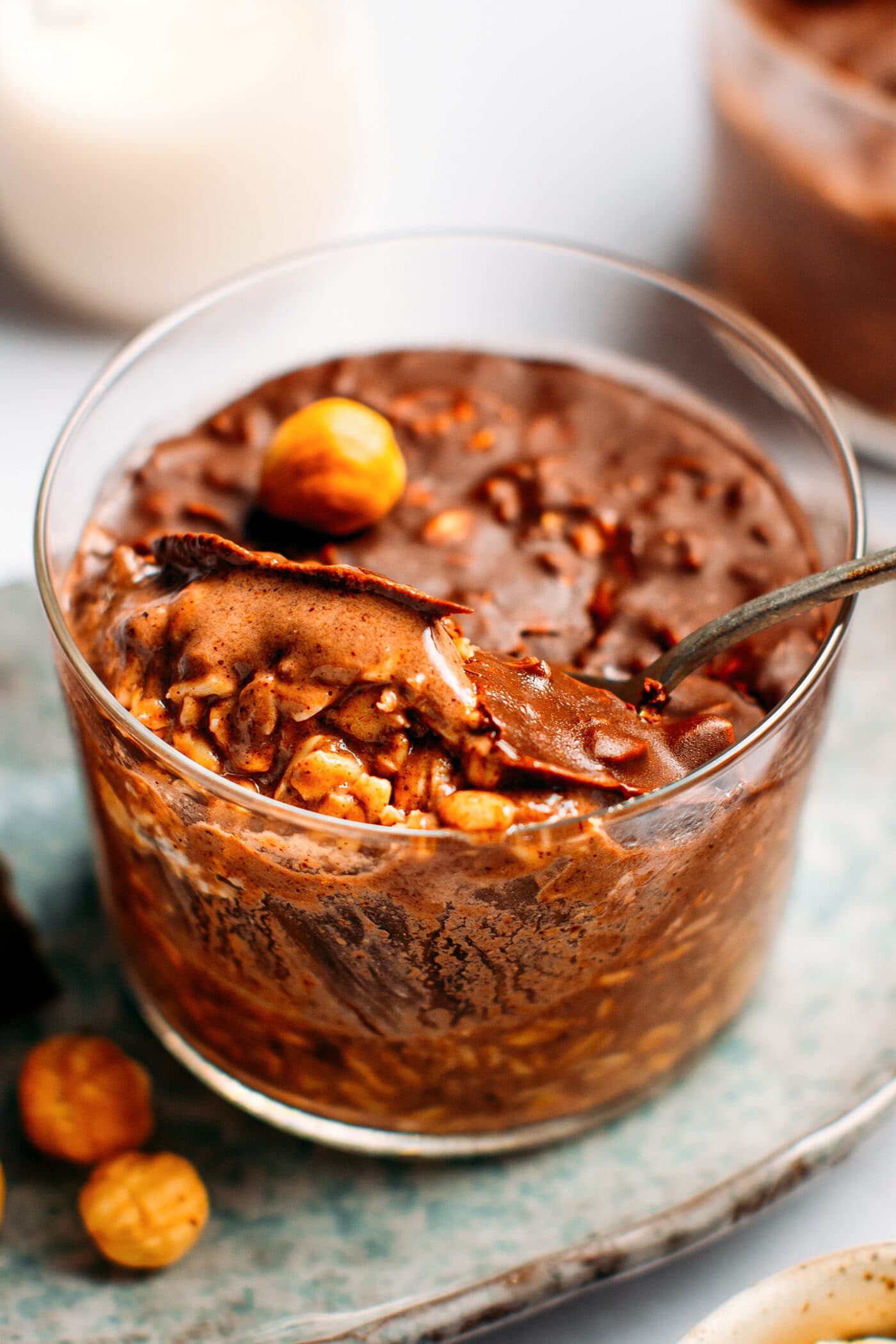 Chocolate overnight oats topped with a crispy chocolate shell.