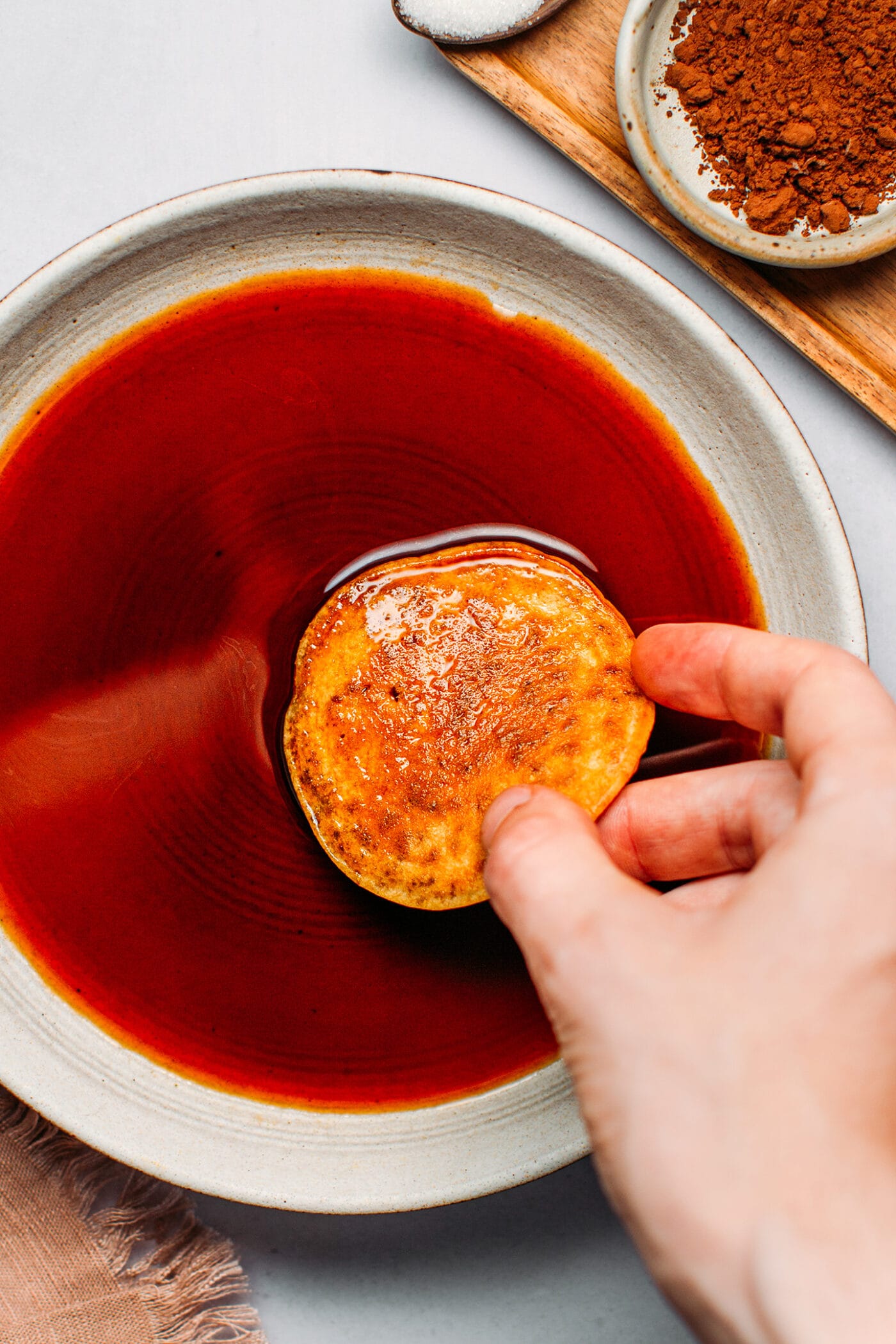 Dipping pancakes in espresso.