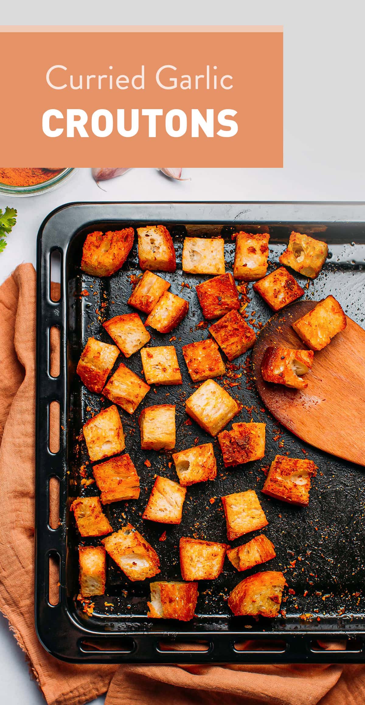 Crispy oven-baked croutons that are infused with garlic and curry powder! These homemade croutons are delicious on top of soup, stews, or added to salads! #croutons #vegan #plantbased #bread