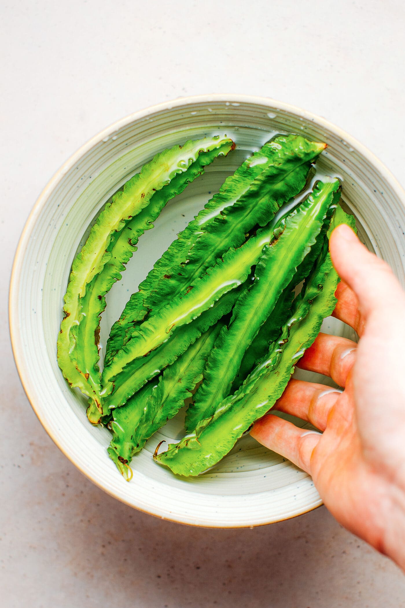 Soaking winged beans in water.