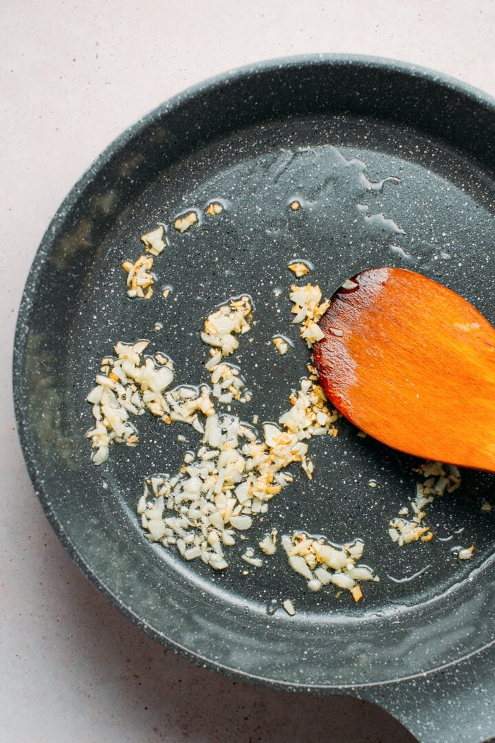 Sautéed garlic in a skillet.