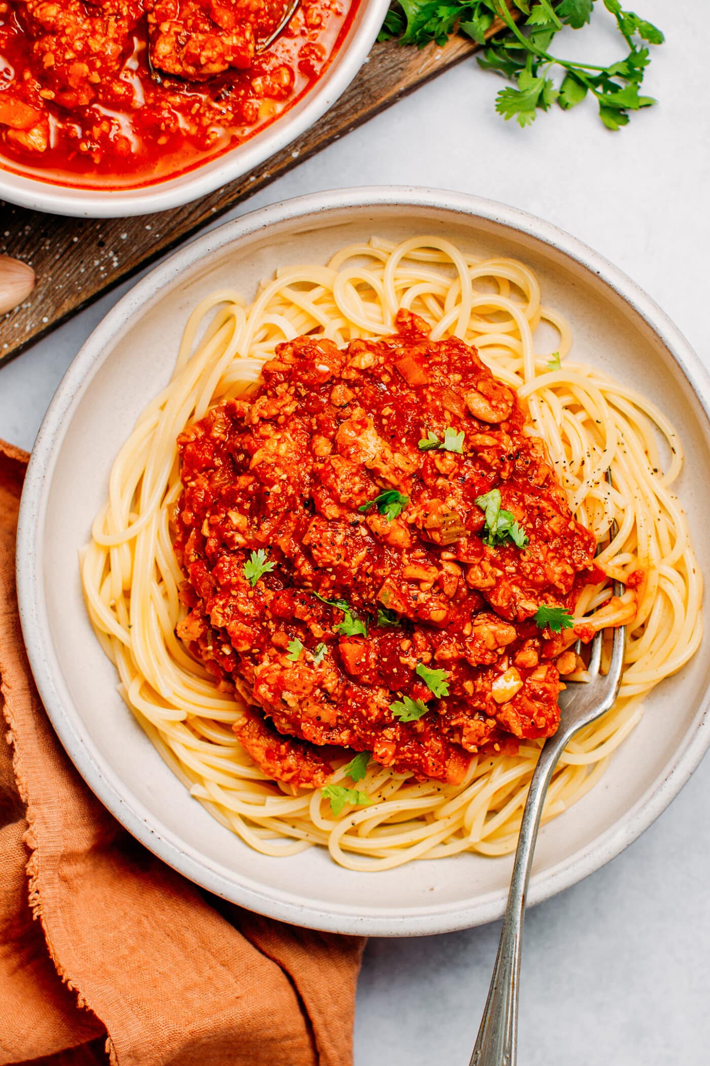 Vegan bolognese sauce on top of spaghetti.