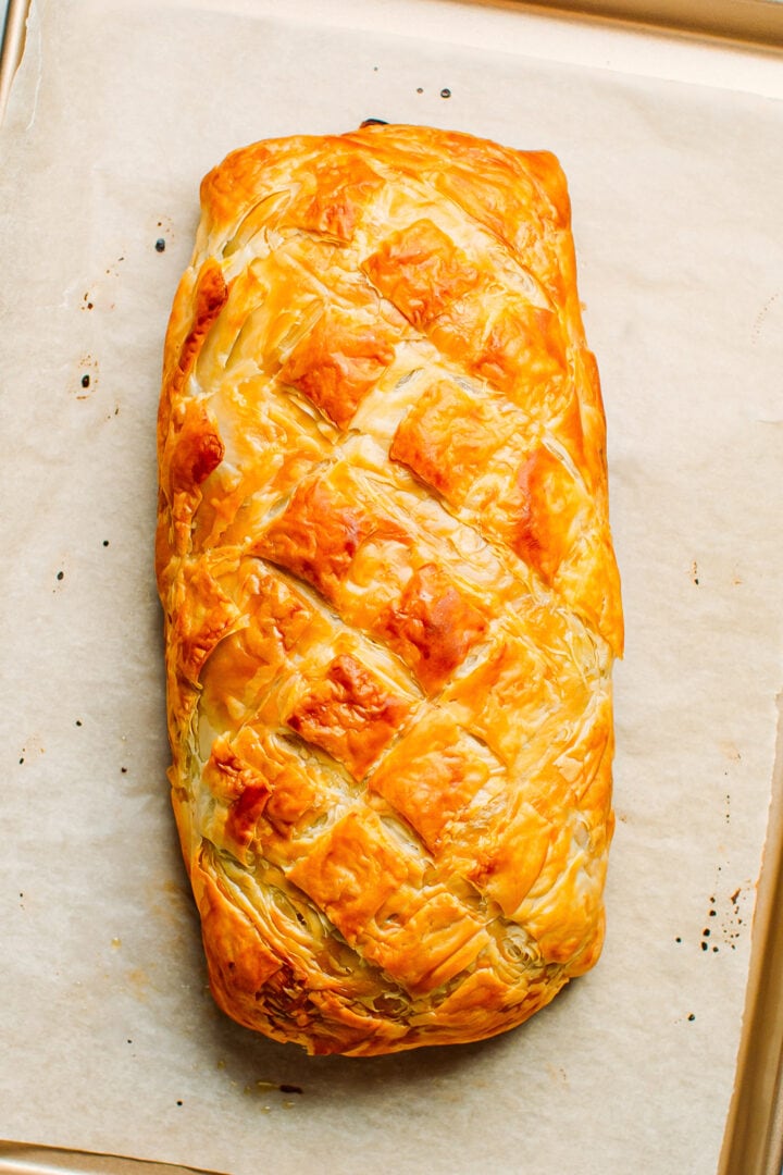 Baked vegan Wellington on a baking sheet.