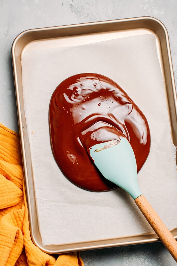 Melted chocolate on a baking sheet.