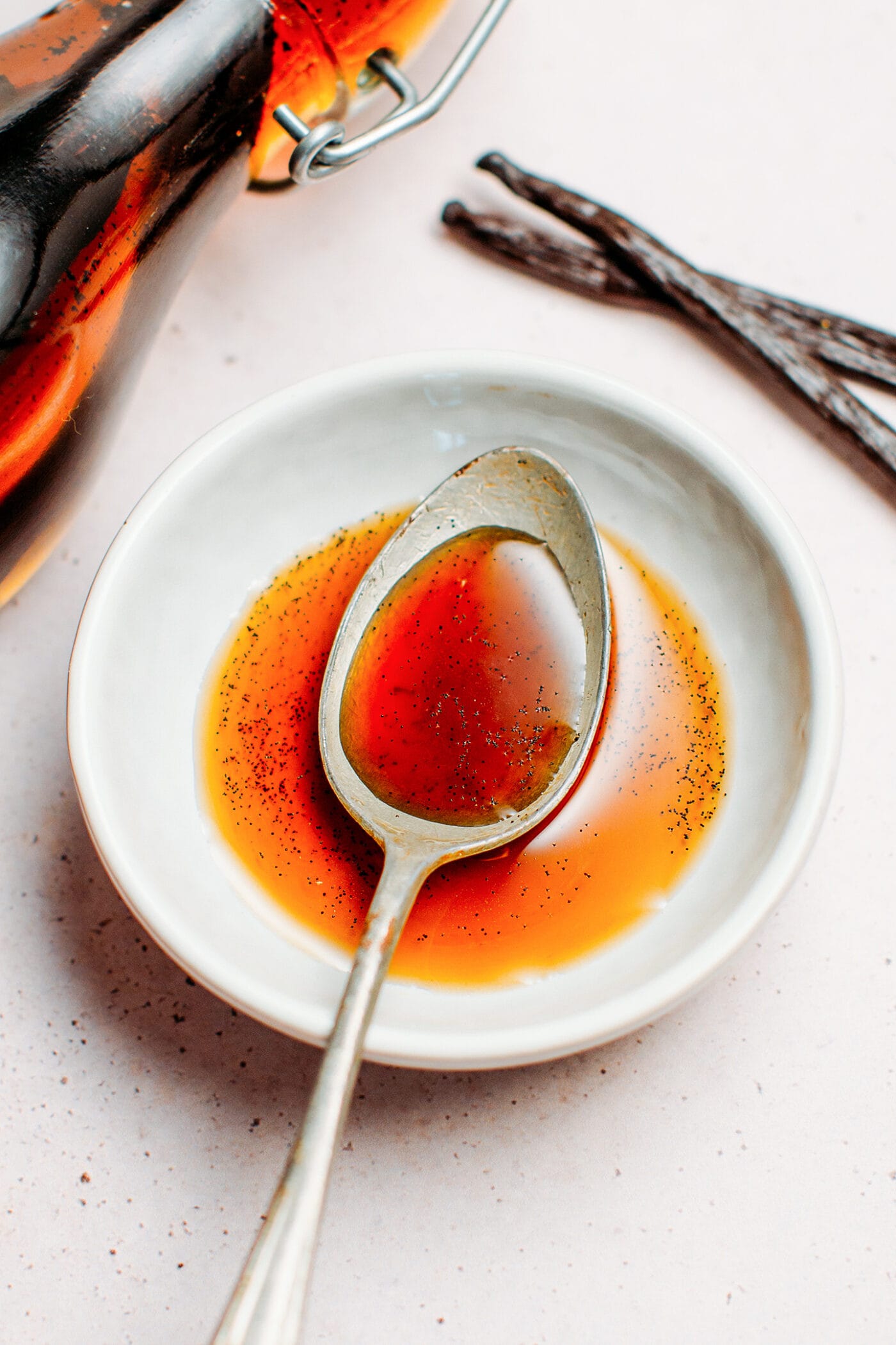 Close up of a spoonful of vanilla extract.