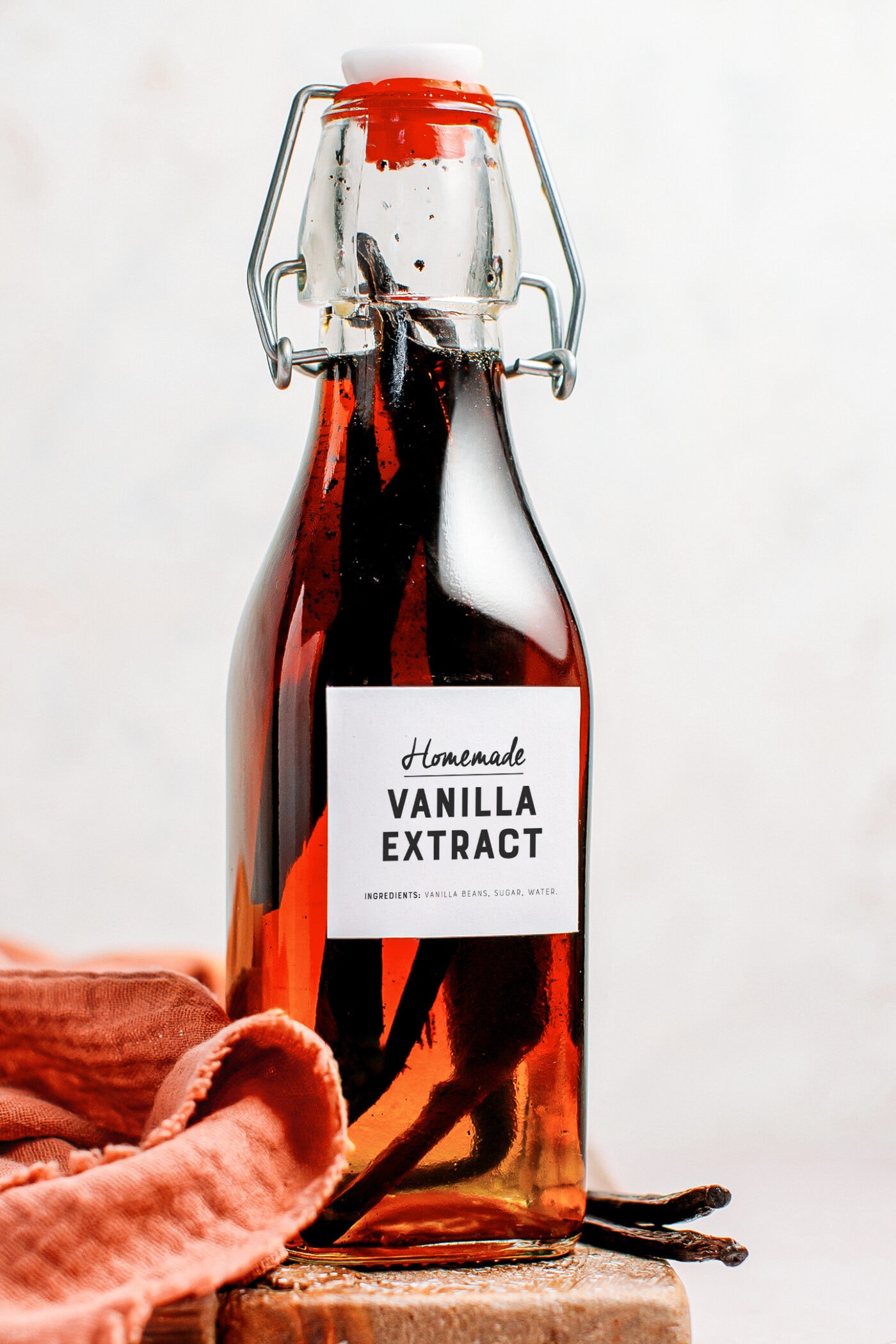 Bottle of homemade vanilla extract with vanilla beans.