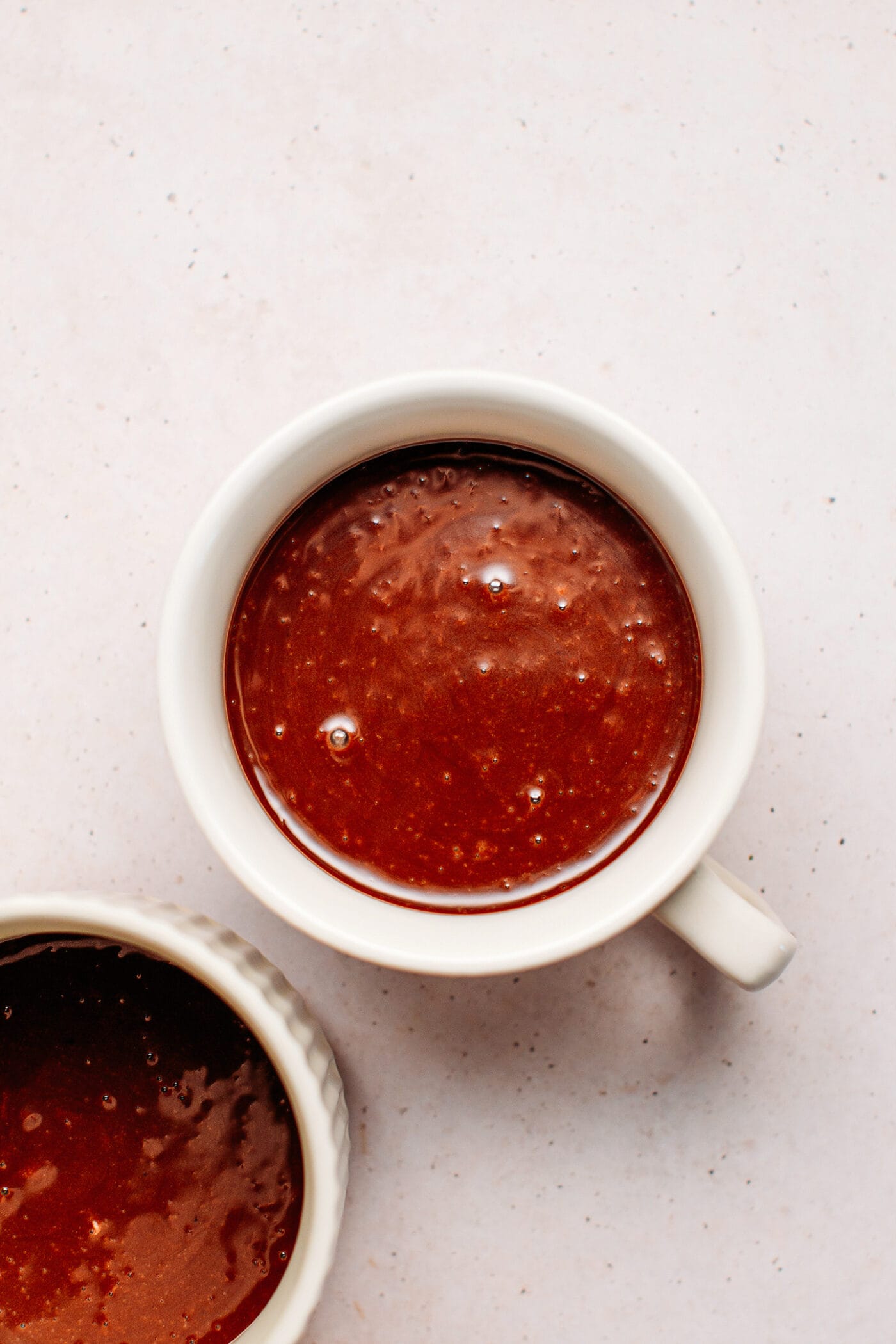 Chocolate batter in a mug.