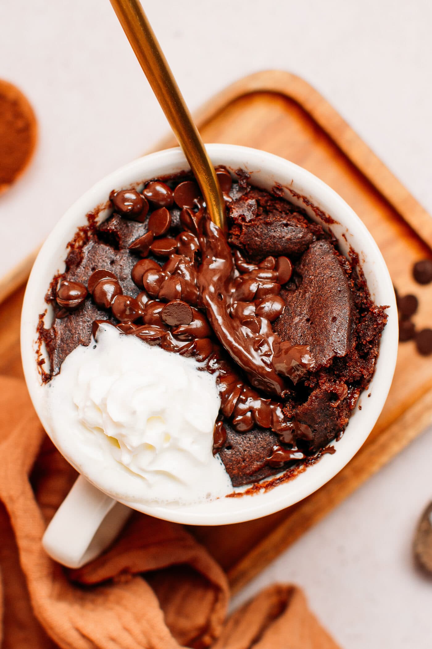 Close up of chocolate mug cake topped with mini chocolate chips.