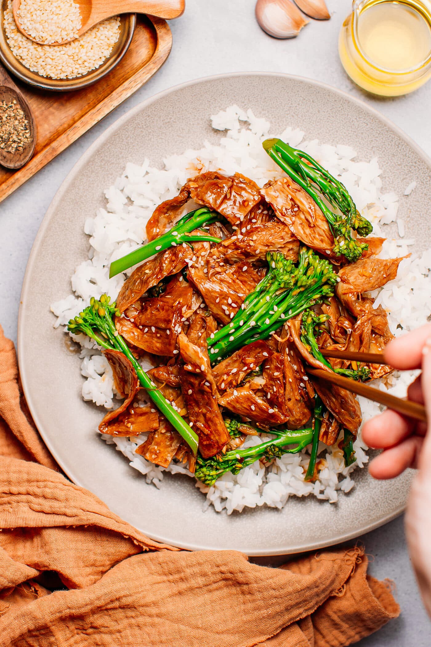 Vegan beef and broccoli on top of white rice.