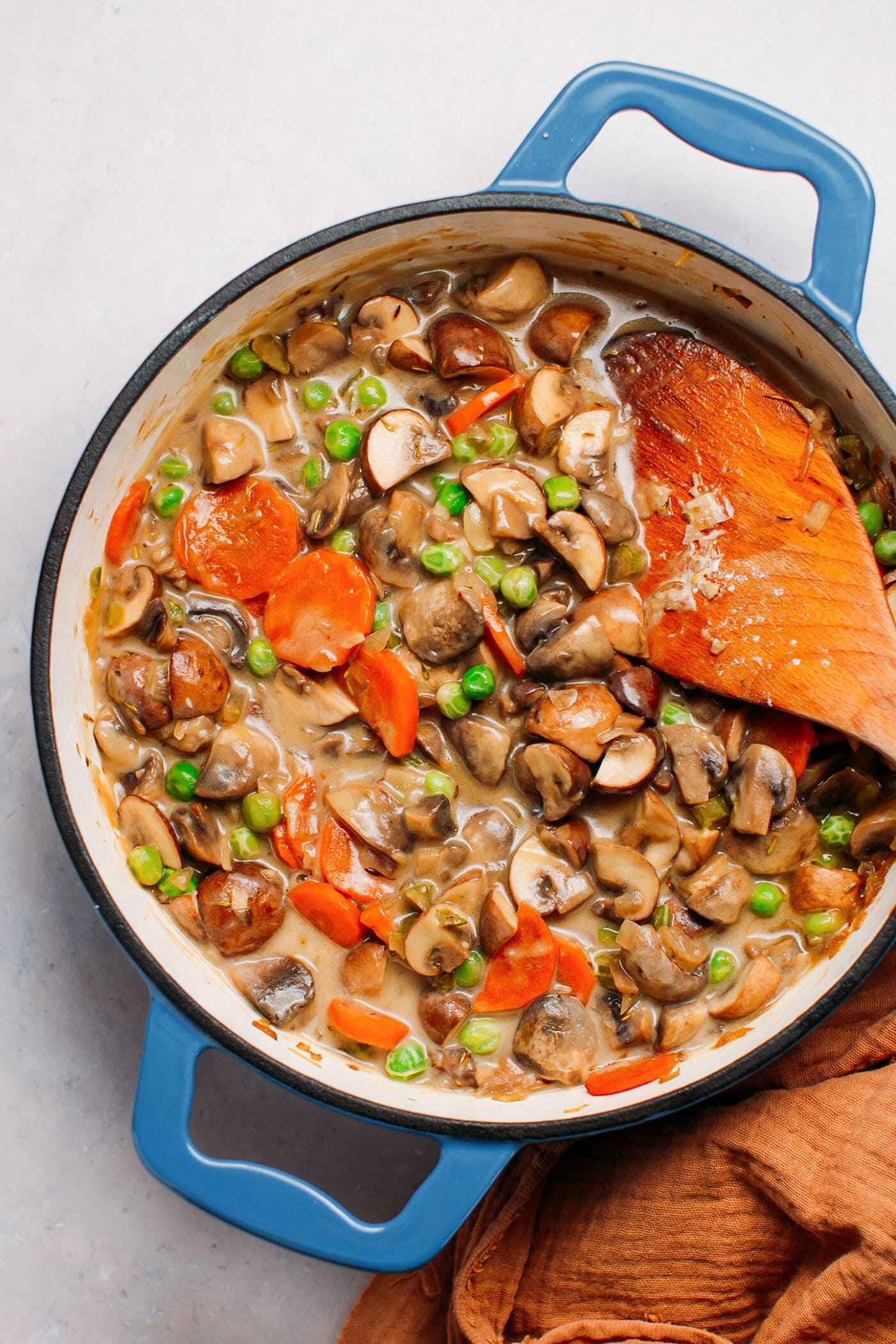 Mushrooms, carrots, and green peas in a gravy sauce.