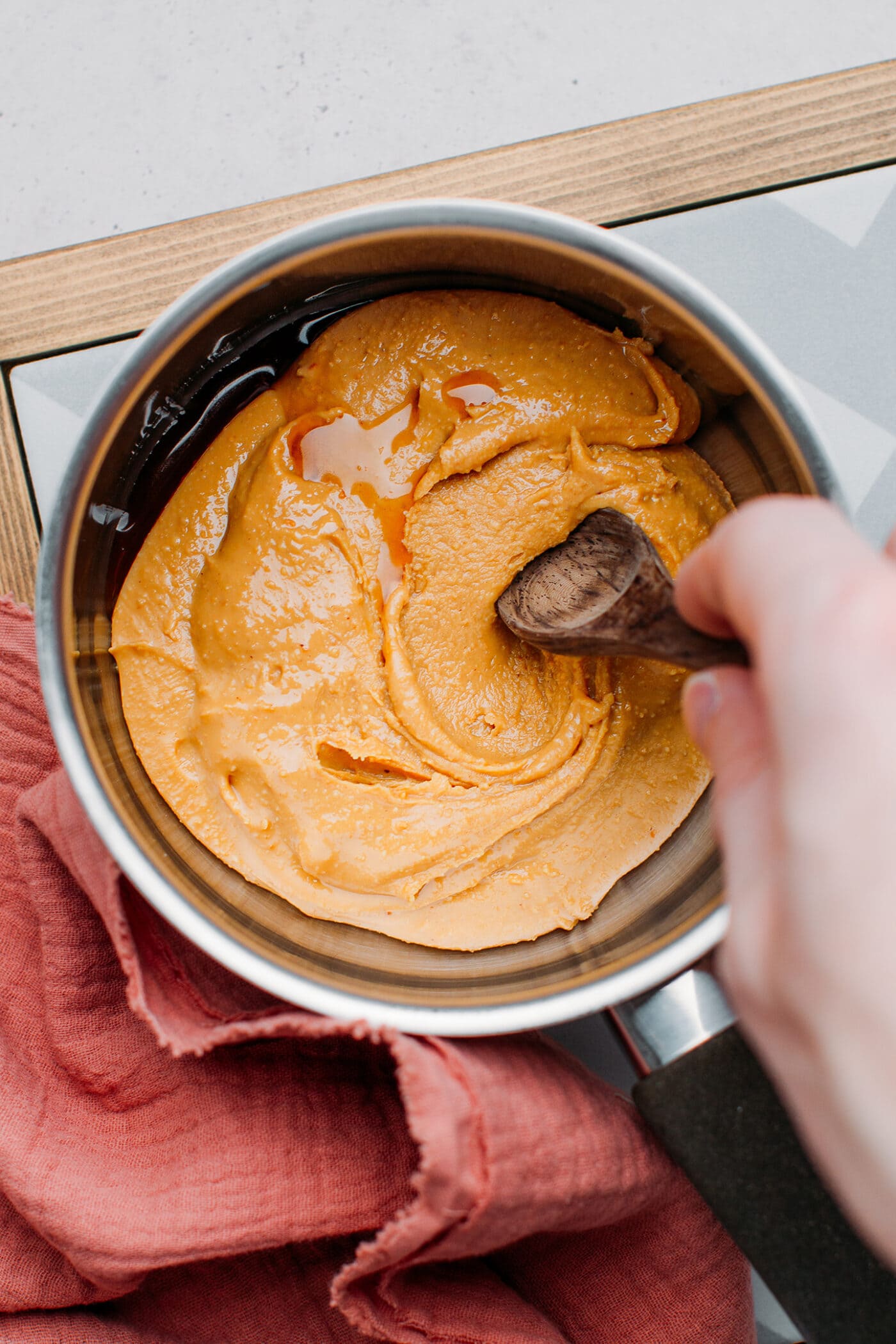 Peanut butter and vanilla extract in a saucepan.