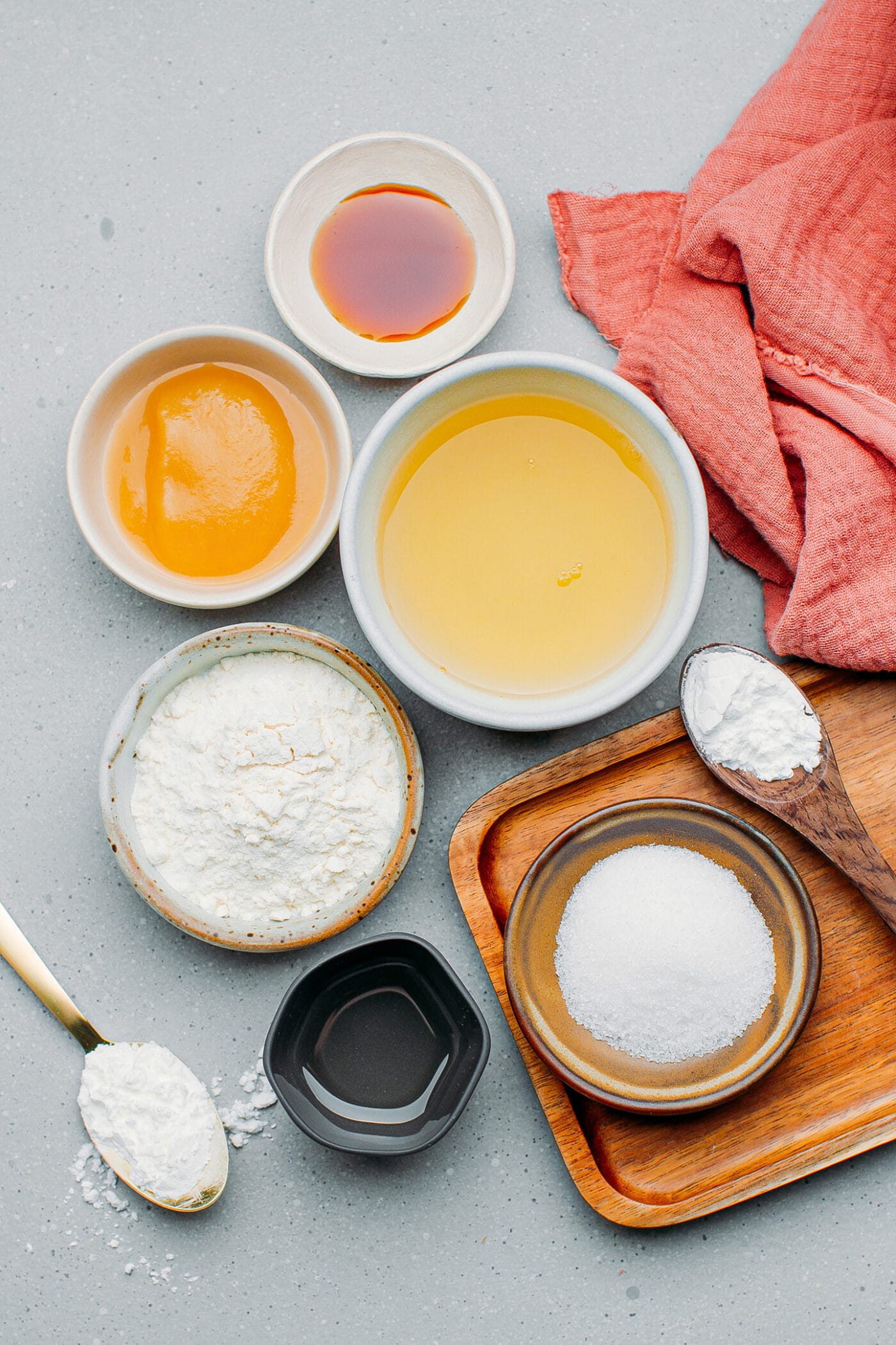 Ingredients like aquafaba, flour, sugar, apple sauce, and vanilla extract.