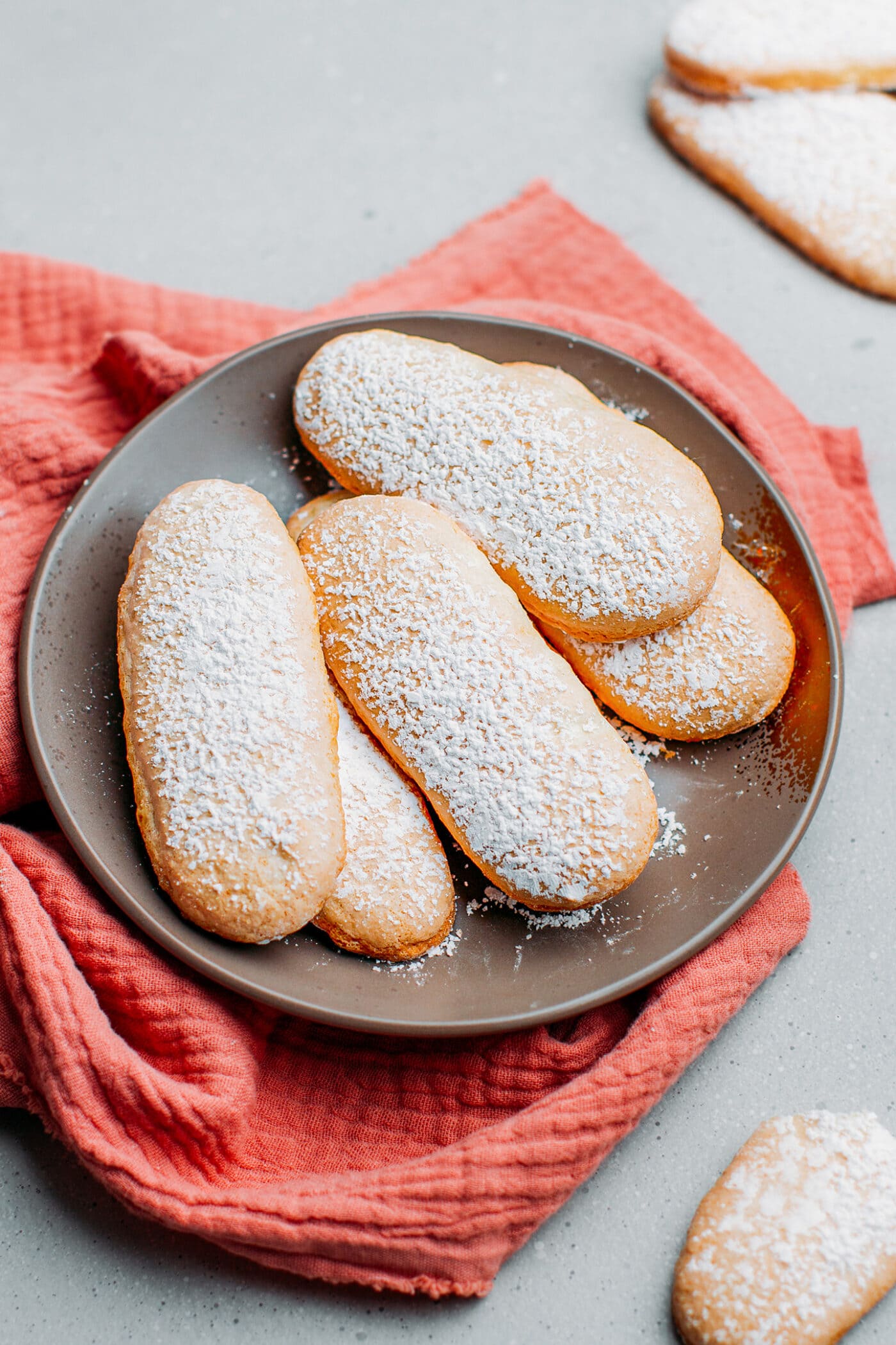 Vegan ladyfingers on a small plate.